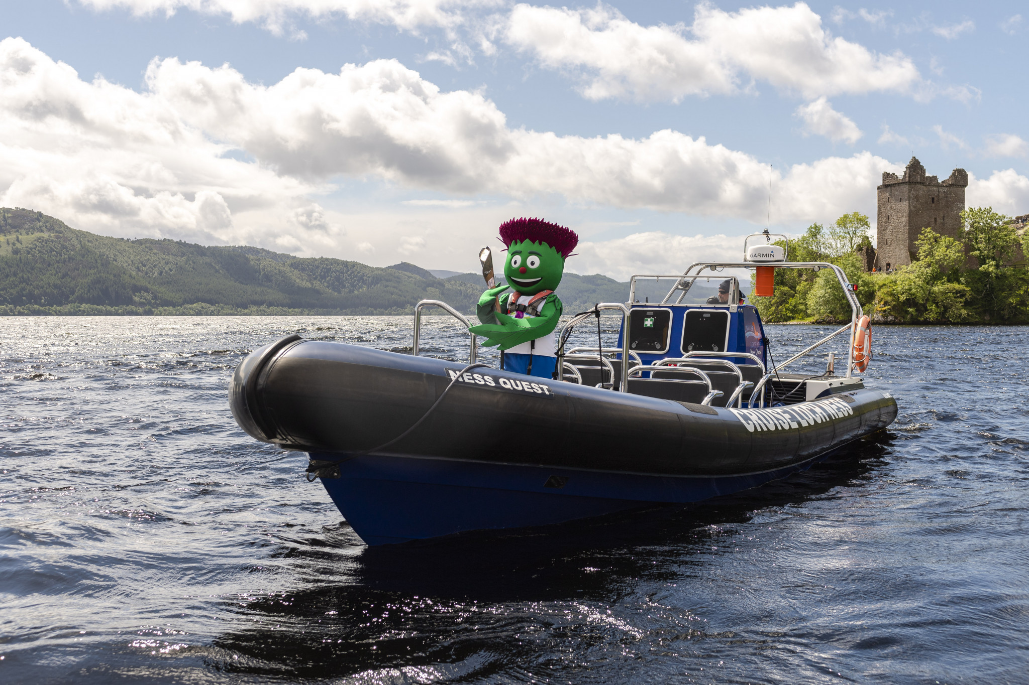 There was no sign of the monster as Glasgow 2014 mascot Clyde carried the Baton across Loch Ness ©Getty Images