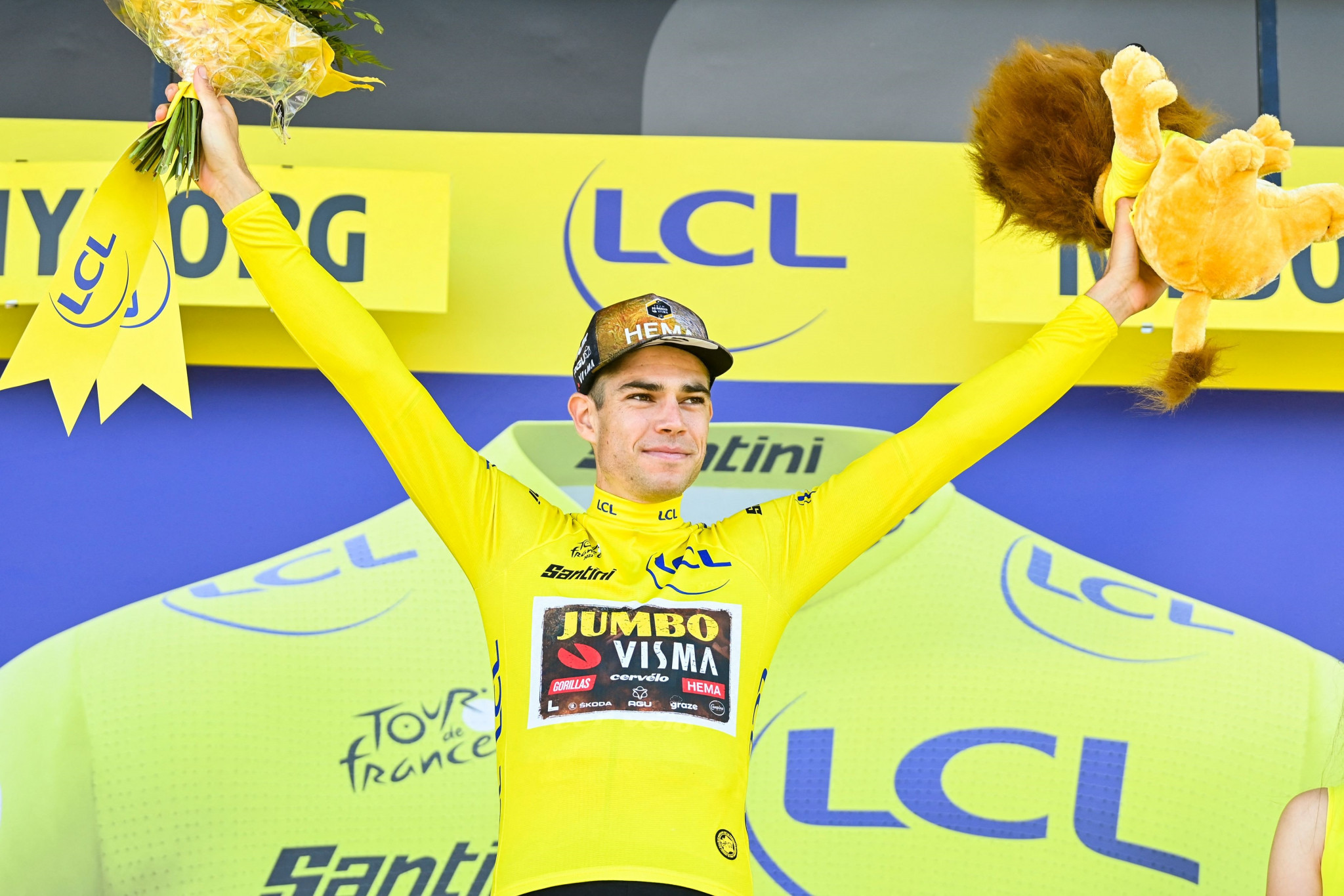 Belgium's Wout van Aert stands at the top of the podium with the yellow jersey ©Getty Images