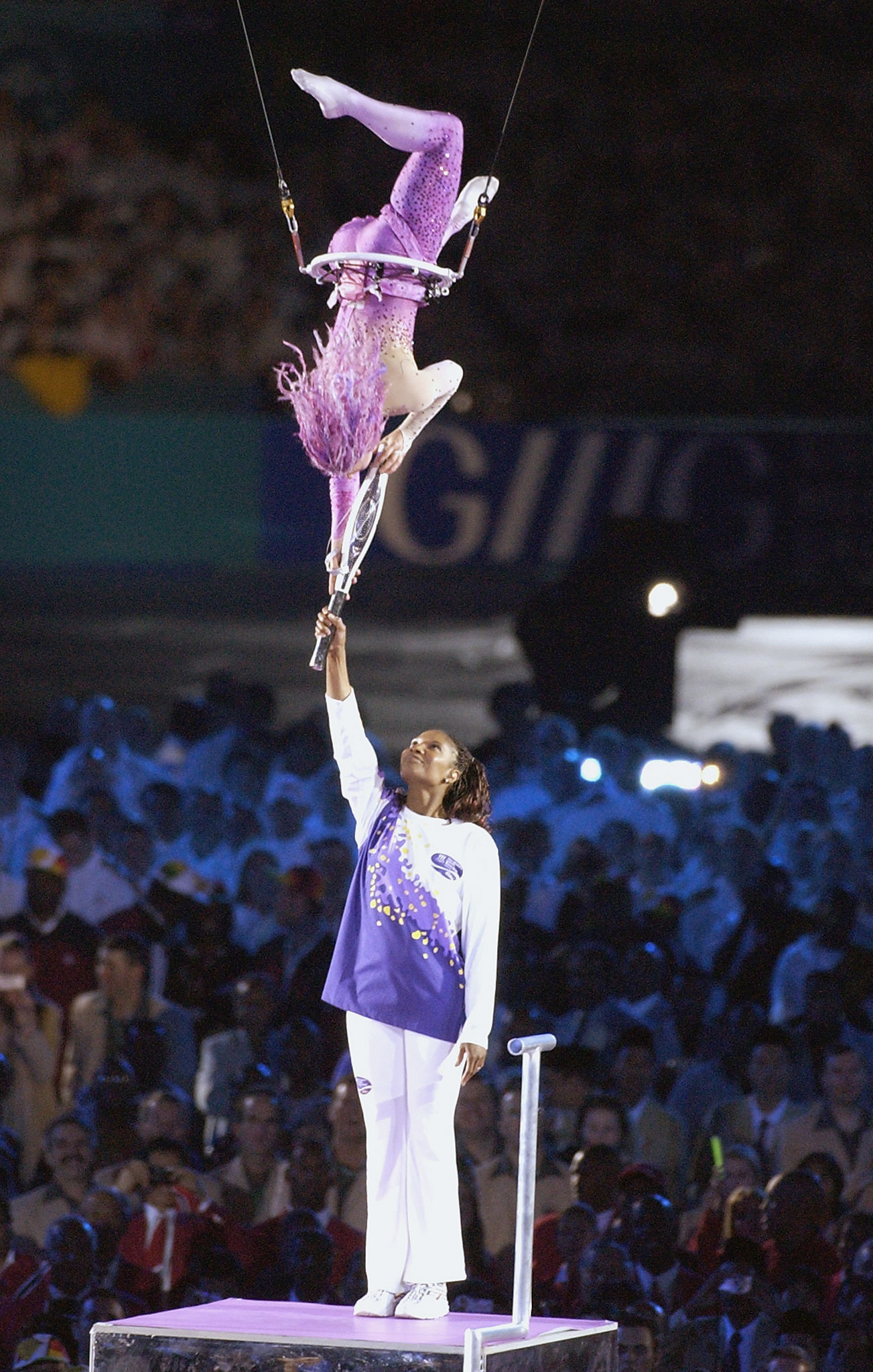 Pregnancy forced Denise Lewis to miss the 2002 Games but she received the Queen's Baton from an aerialist at the Opening Ceremony in Manchester  ©Getty Images