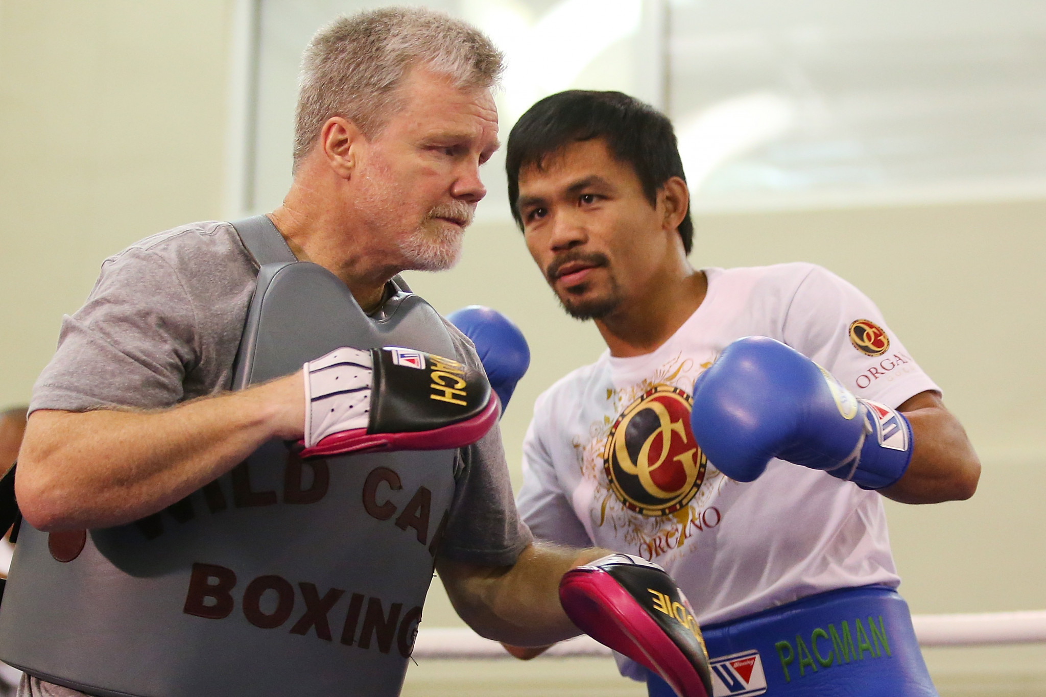Freddie Roach, pictured with his boxer Manny Pacquiao, was at the gym in Los Angeles when the Scottish team visited ©Getty Images