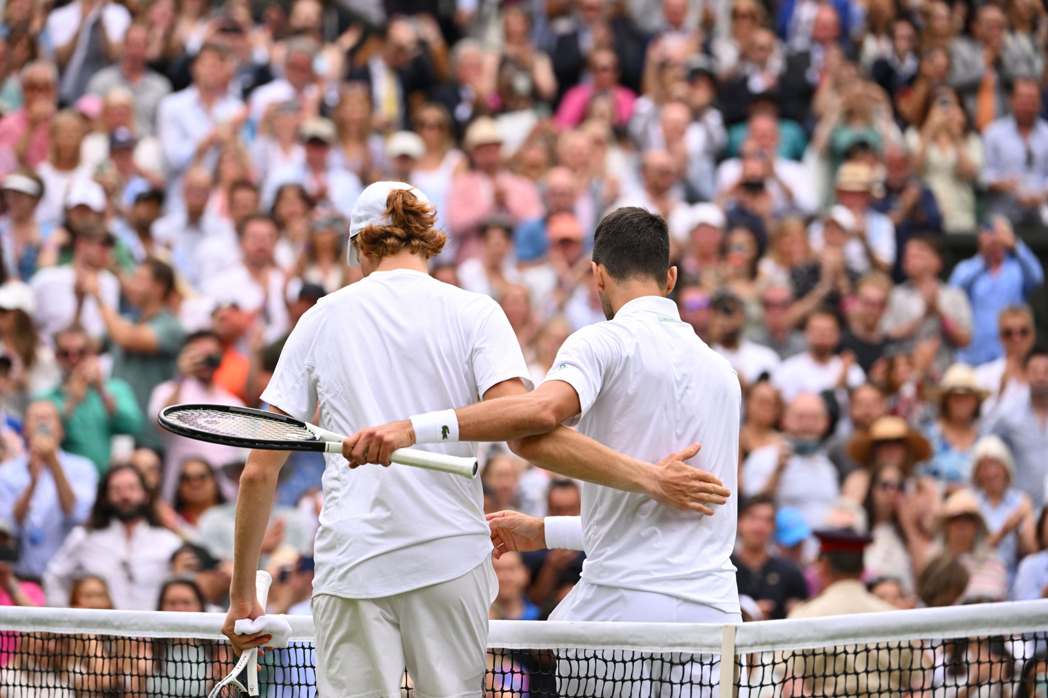 Novak Djokovic sharing an embrace with Jannik Sinner after their match ©Getty Images