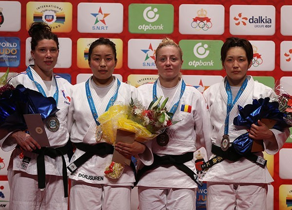 Sumiya Dorjsuren (second left) won one of two Mongolian gold medals on the opening day of action in Rabat ©IJF