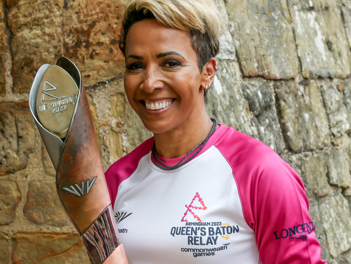 Double Olympic champion Dame Kelly Holmes carries Commonwealth Games Queen's Baton in Tonbridge