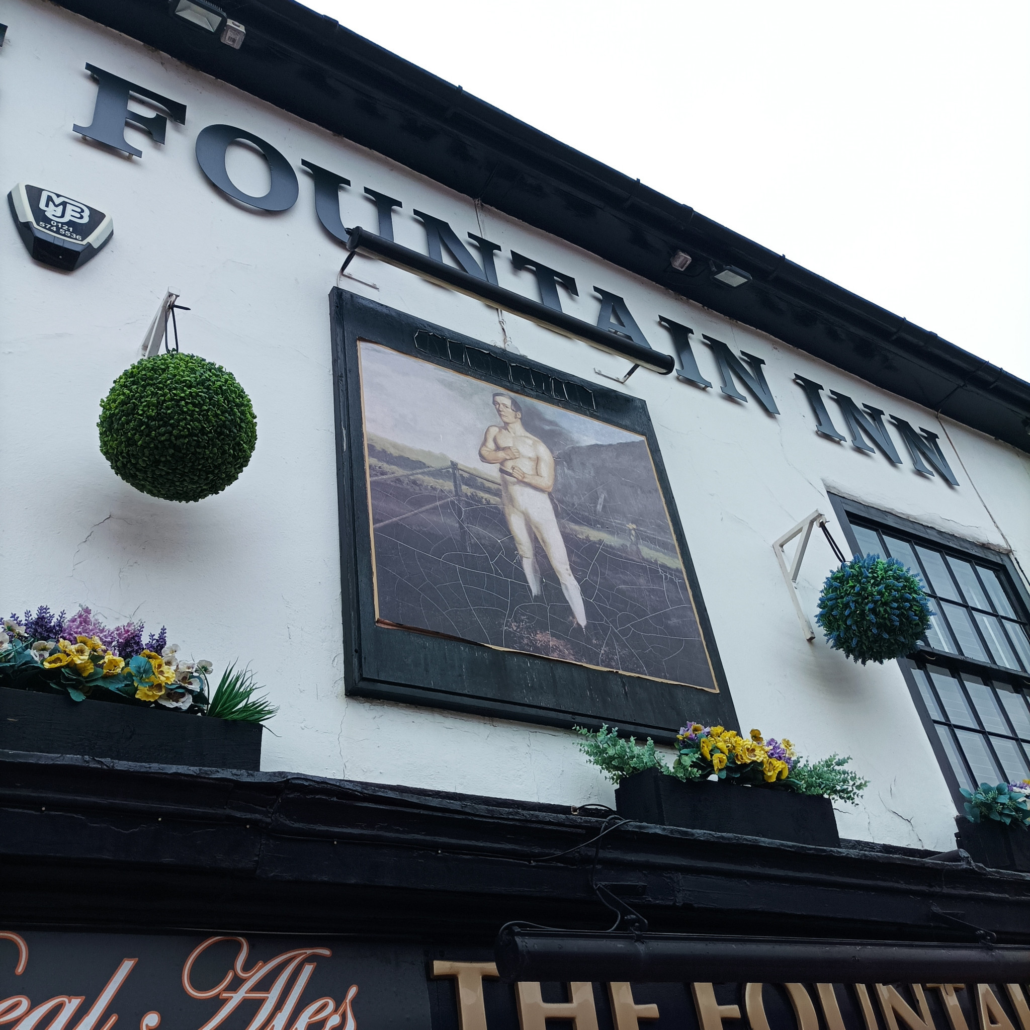 A painting, thought to be of William Perry is displayed above The Fountain Inn in Tipton  ©ITG