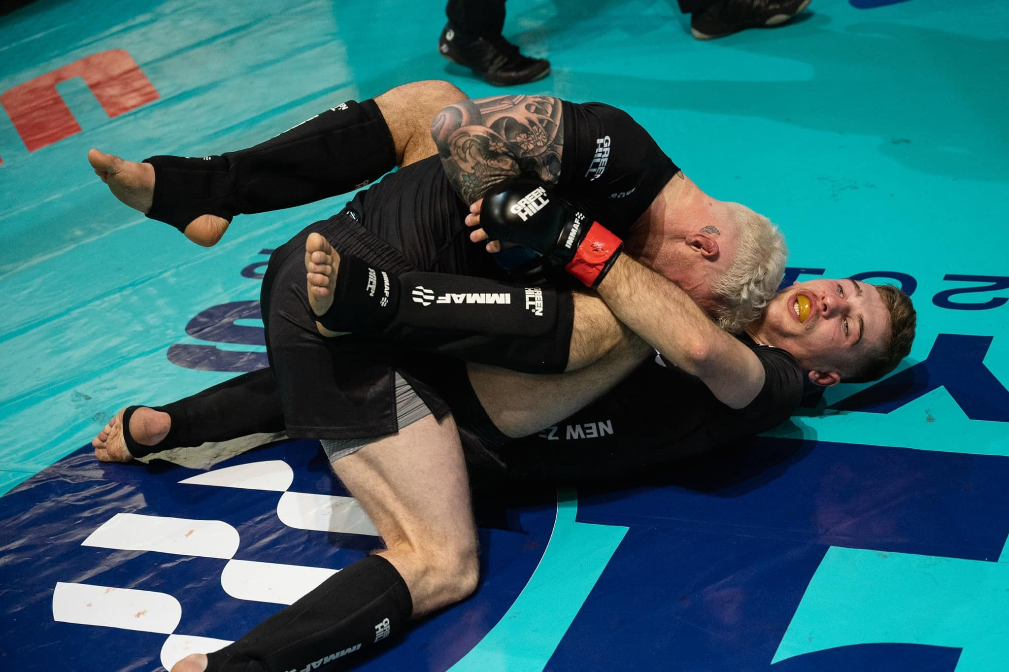 Fighters battled it out in semi-final matches yesterday but competition will now conclude as a national event ©IMMAF