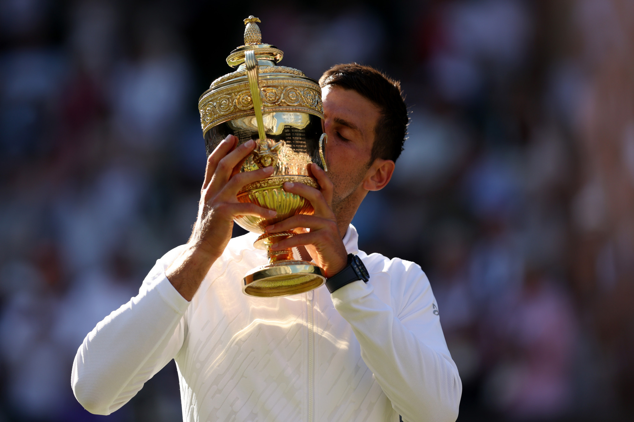 Djokovic claims fourth Wimbledon title in a row against Kyrgios as Peng Shuai protester interrupts play 