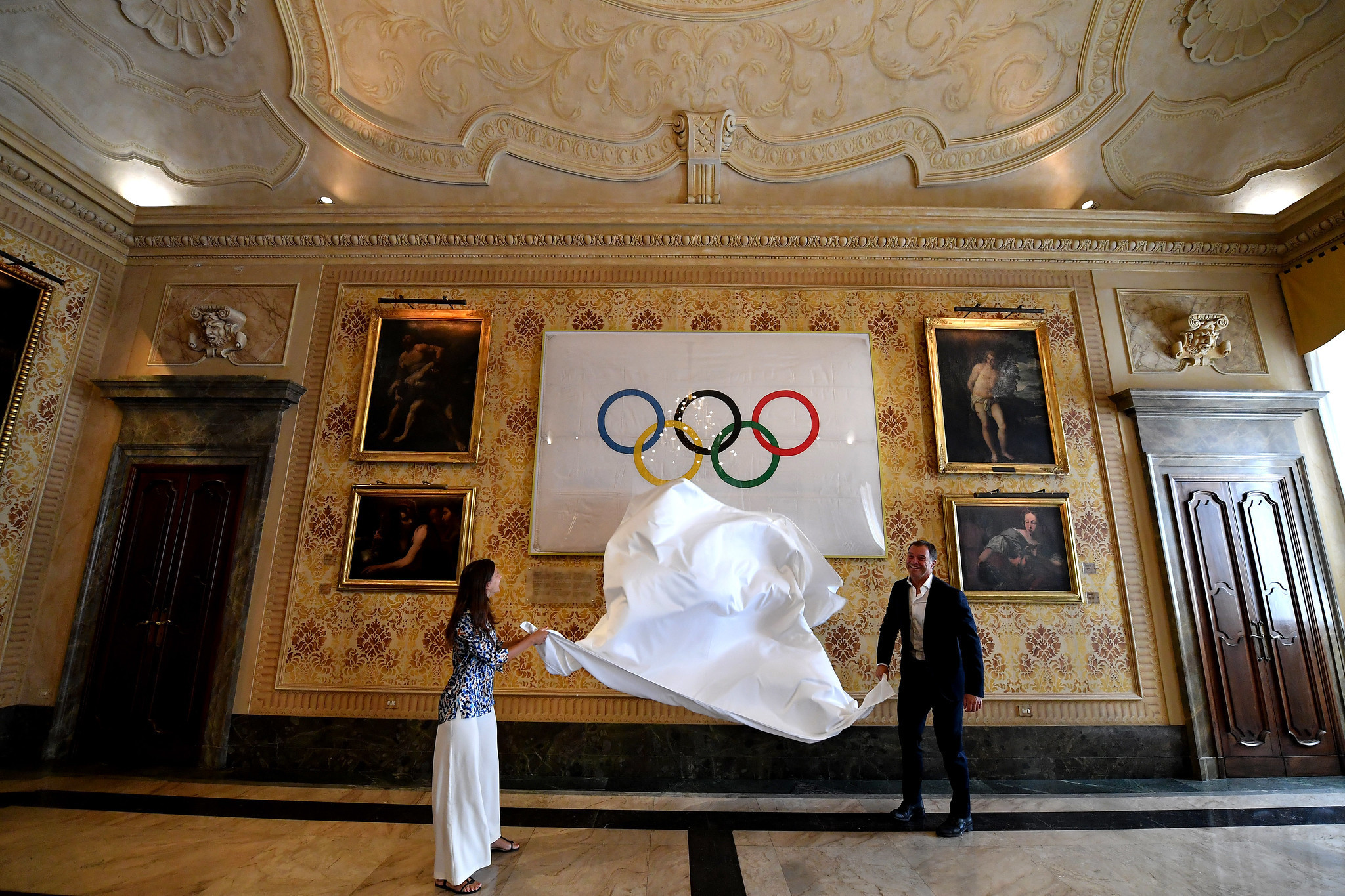 Olympic and Paralympic flags go on display at Milan City Hall for 2026 Winter Games