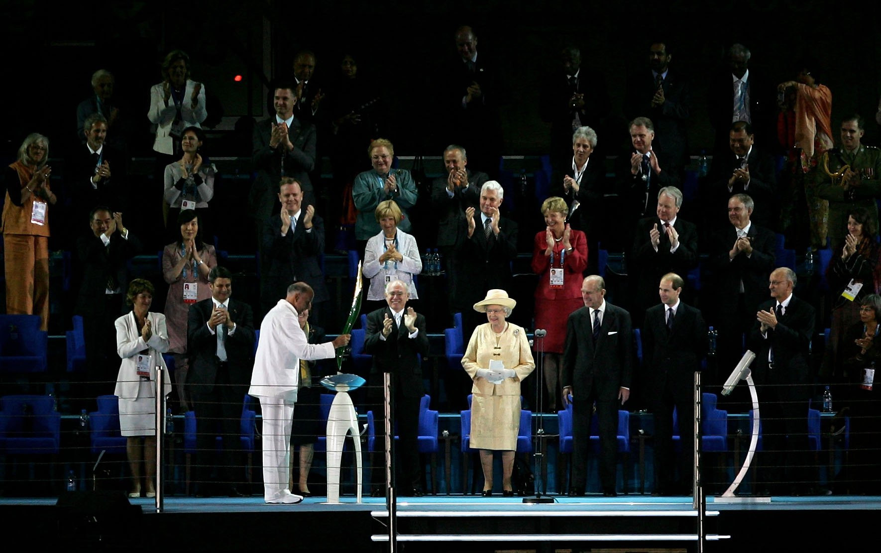 In 2006, Sir John Landy, third from left, pointed the Baton at an autocue screen to activate an electronic version of the Queen's address ©Getty Images