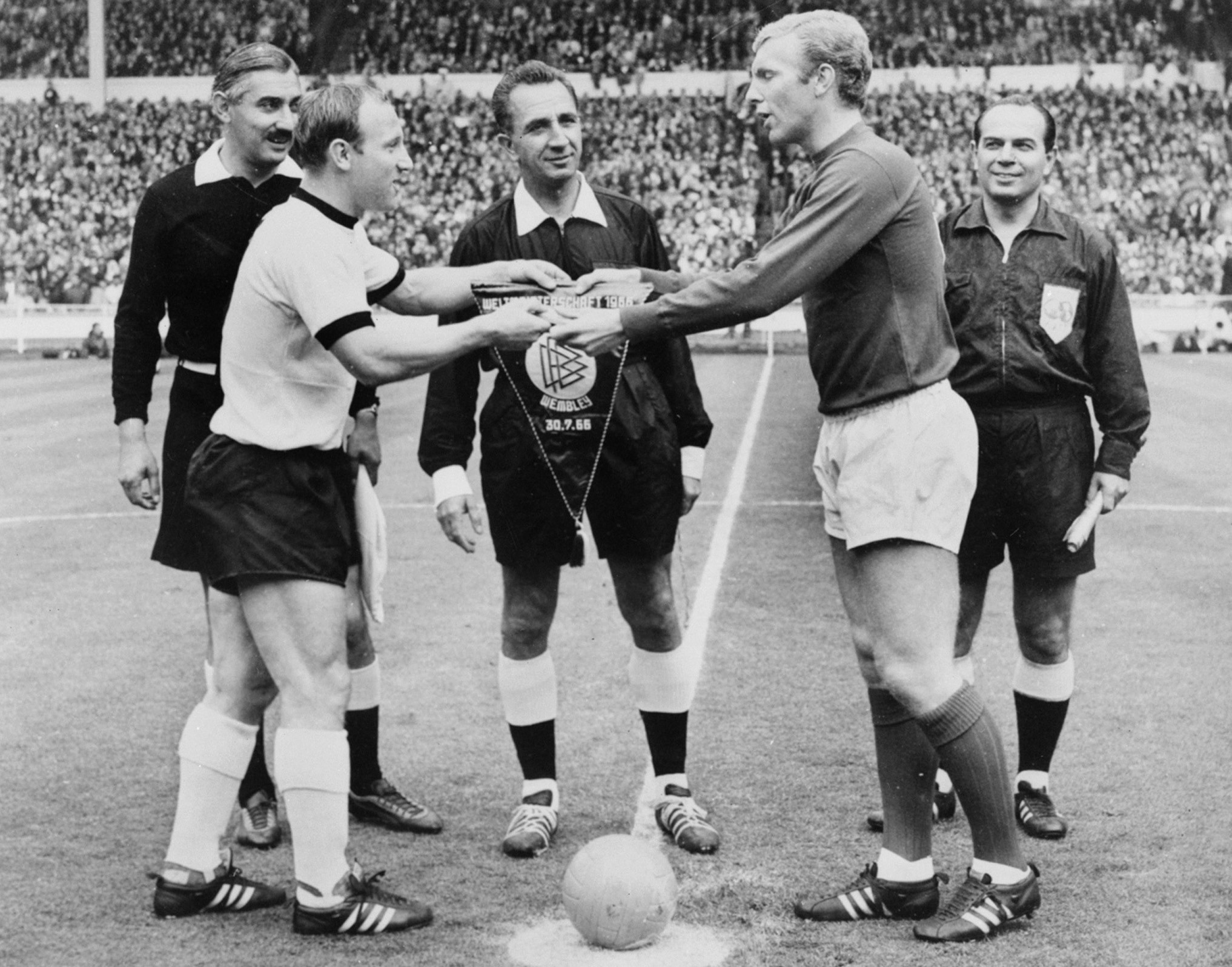 Uwe Seeler, left, captained West Germany in the 1966 FIFA World Cup final against England, who were led by Bobby Moore, right, ran out 4-2 winners ©Getty Images
