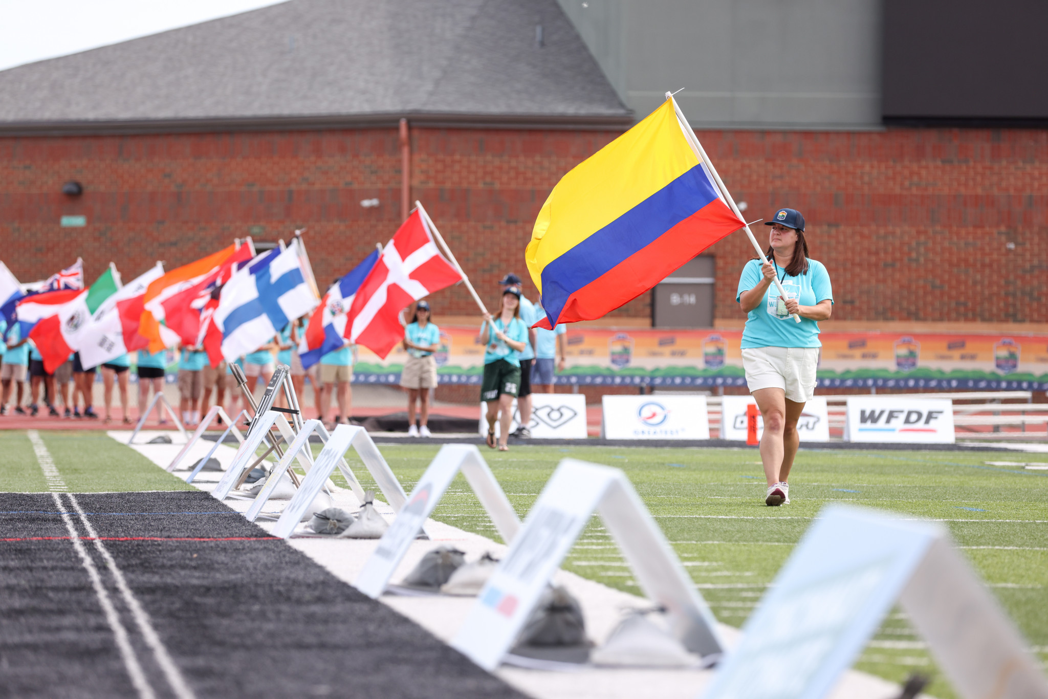 A parade of national flags was staged during the Opening Ceremony of the World Ultimate Club Championships ©Paul Rutherford for Ultiphotos