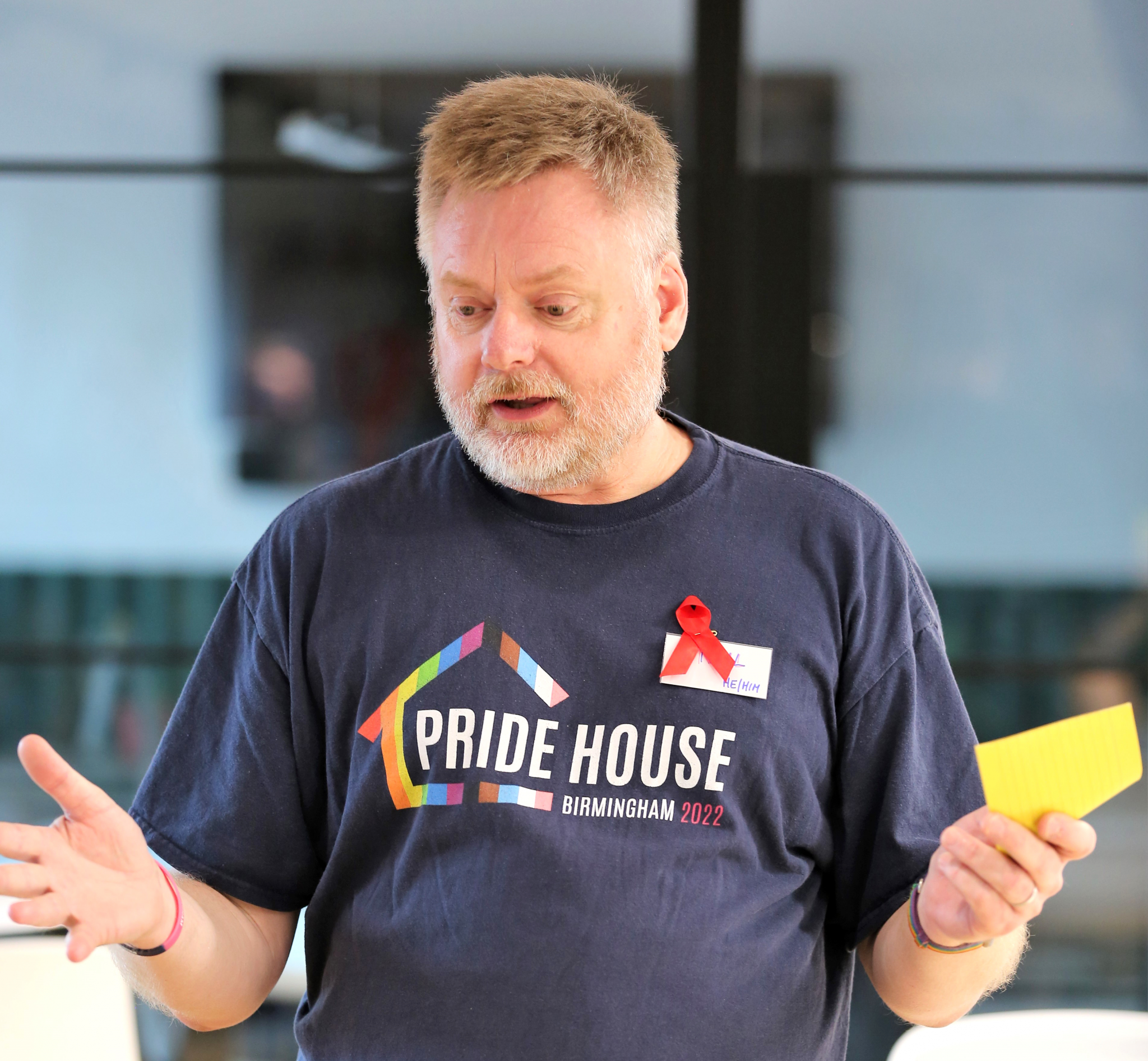 Pride House Executive Board member Neil Basterfield led tributes to those killed by HIV/AIDS ©Nick Hynan