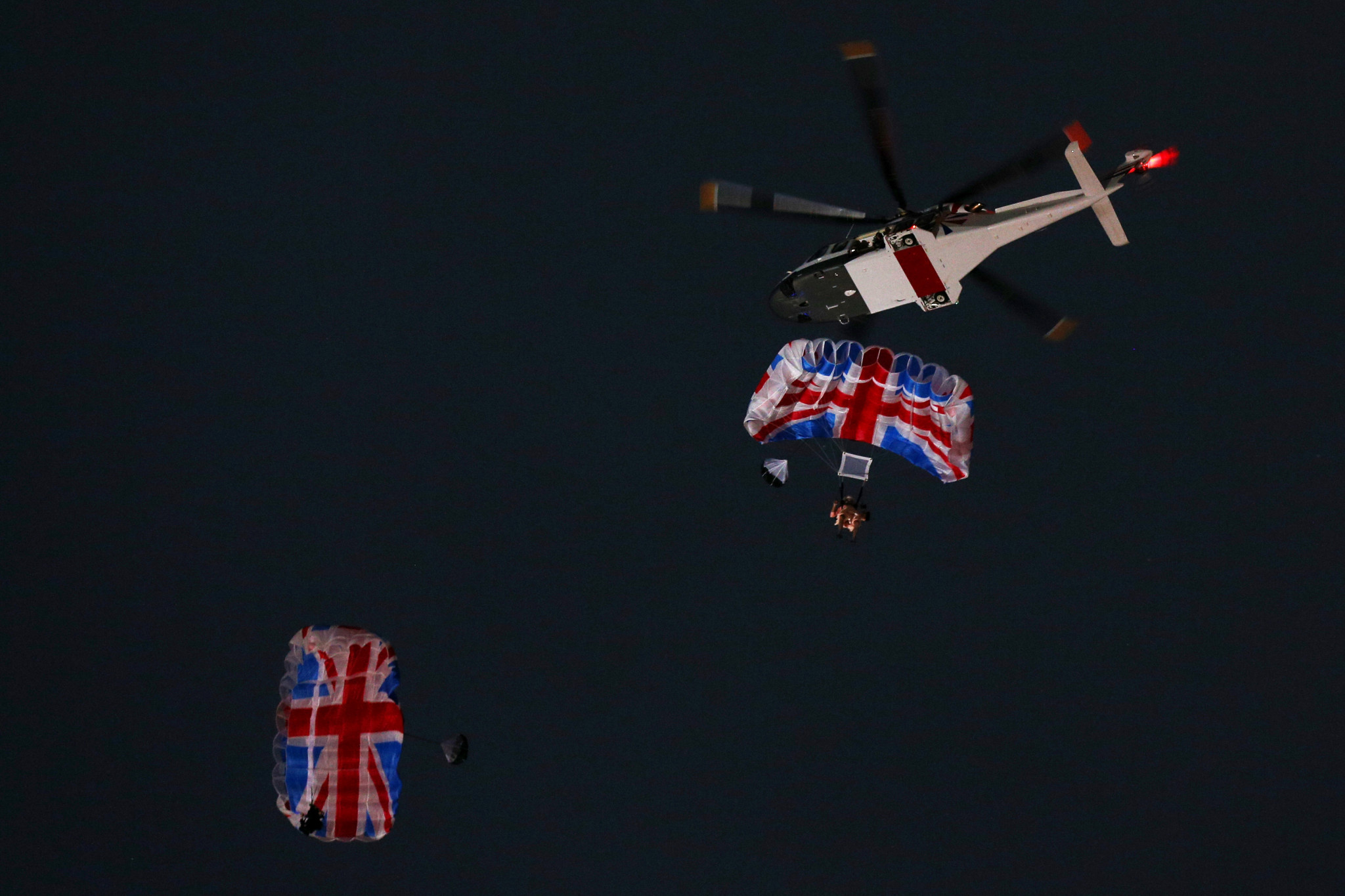 Gary Connery, top, was one of two skydivers who made a descent at the London 2012 Olympic Opening Ceremony for a sketch featuring the Queen ©Getty Images