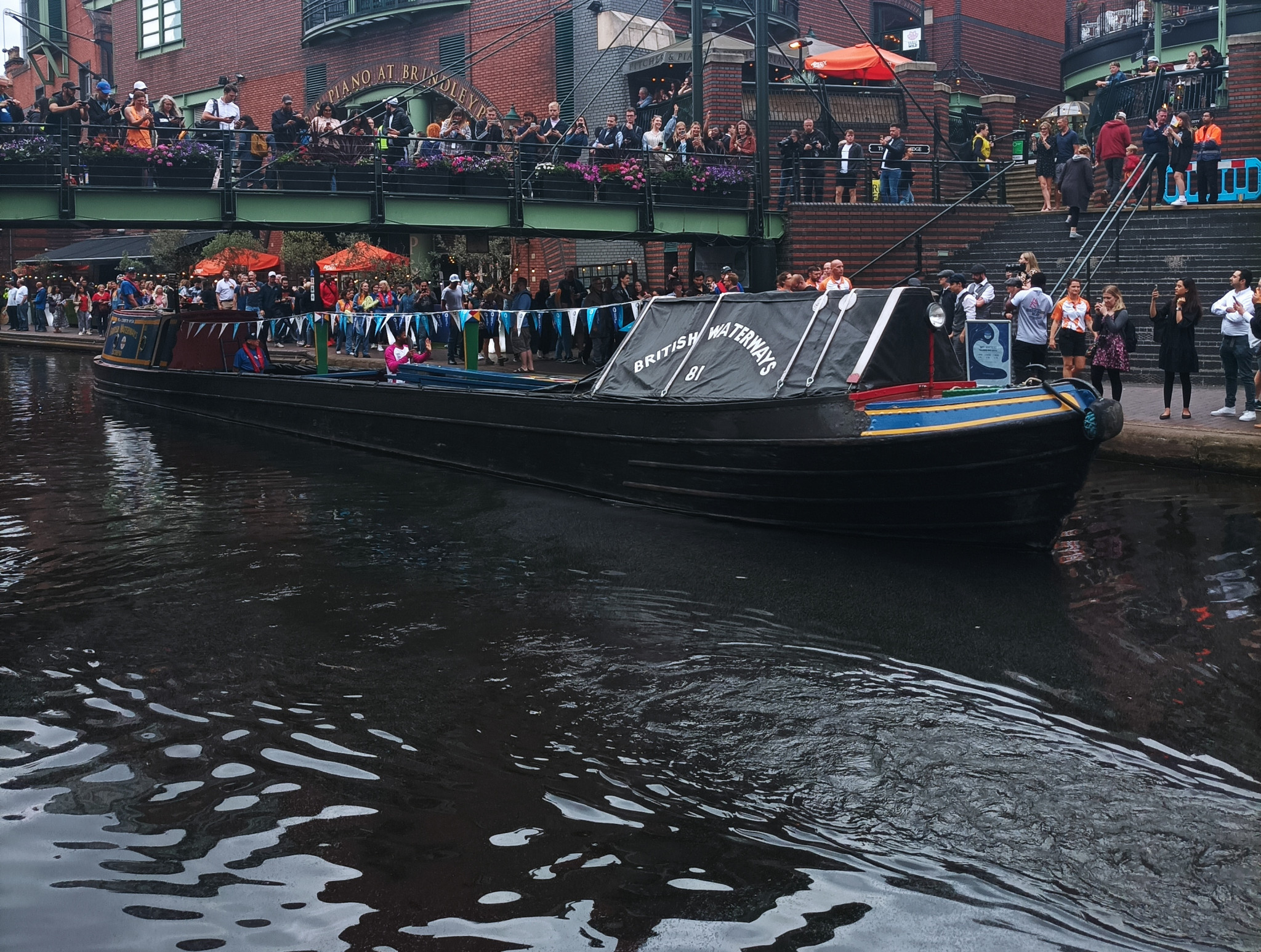 Dr Kishan Bodalia carried the Baton on board a canalboat as it made its journey around Birmingham ©ITG