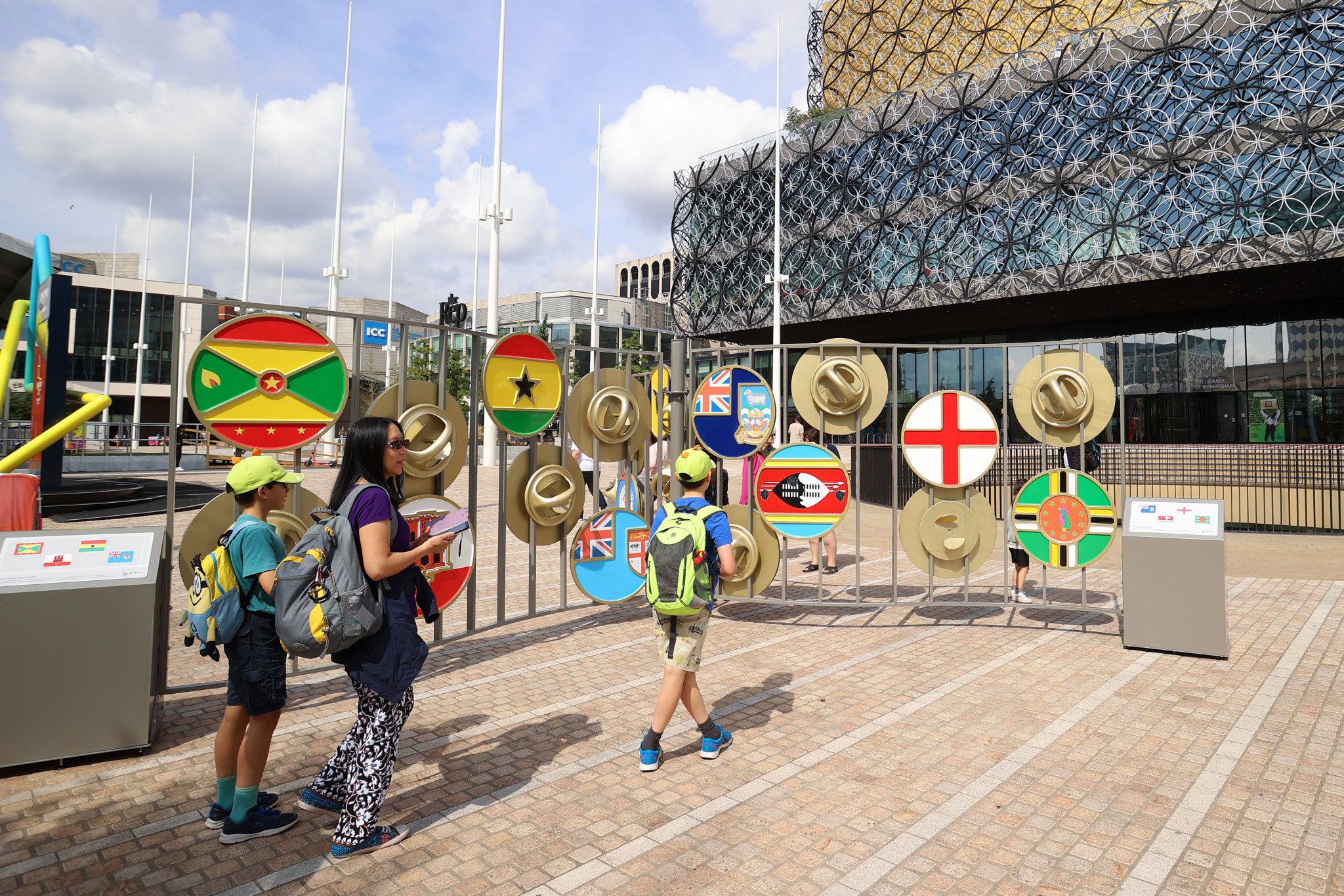 The public look at flags of the Commonwealth in Birmingham ©Getty Images