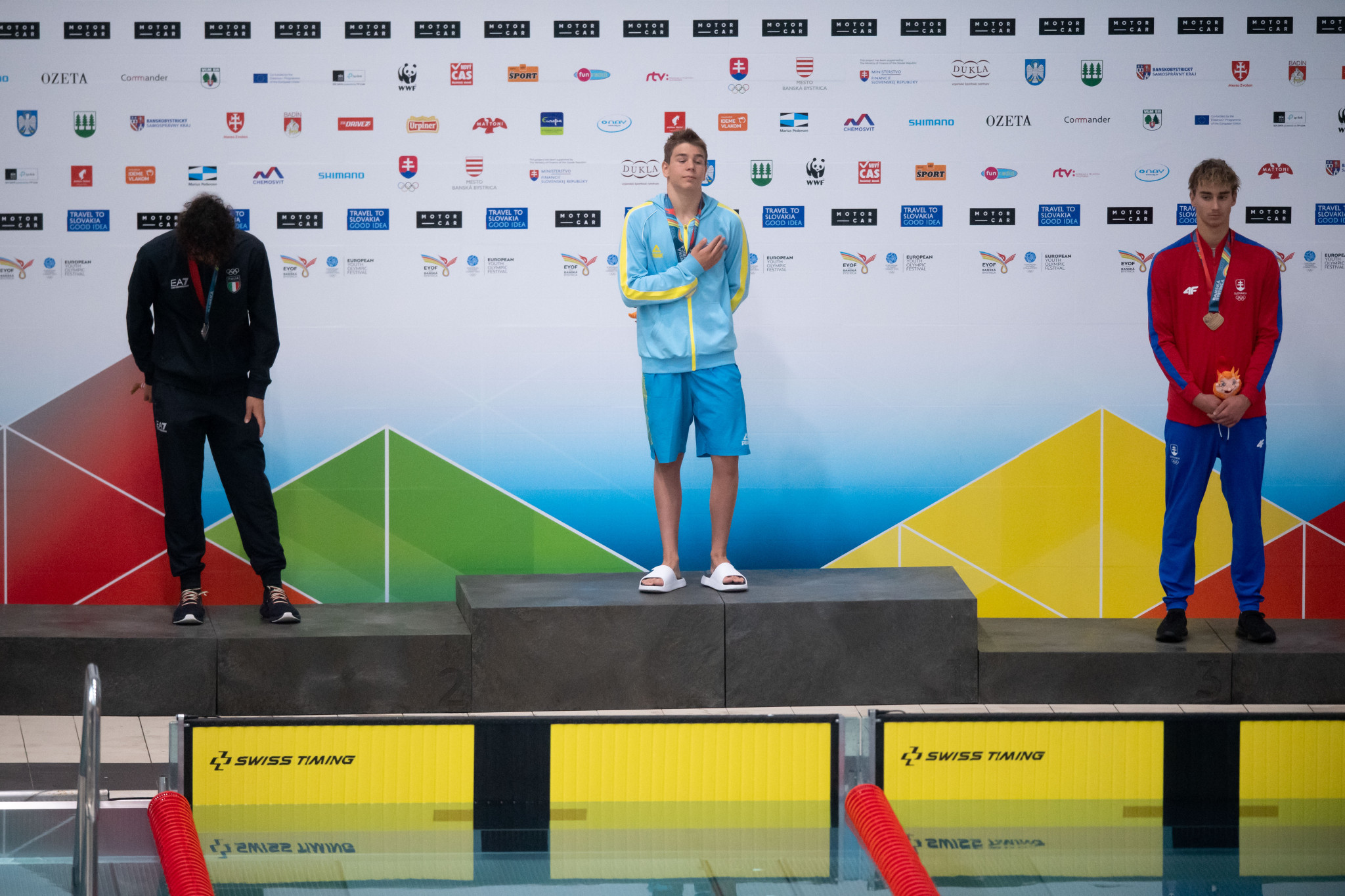 Ukraine's Mykola Kotenko, centre, produced an emotional gold medal-winning performance in the boys' 200m butterfly decider ©EYOF Banská Bystrica 2022
