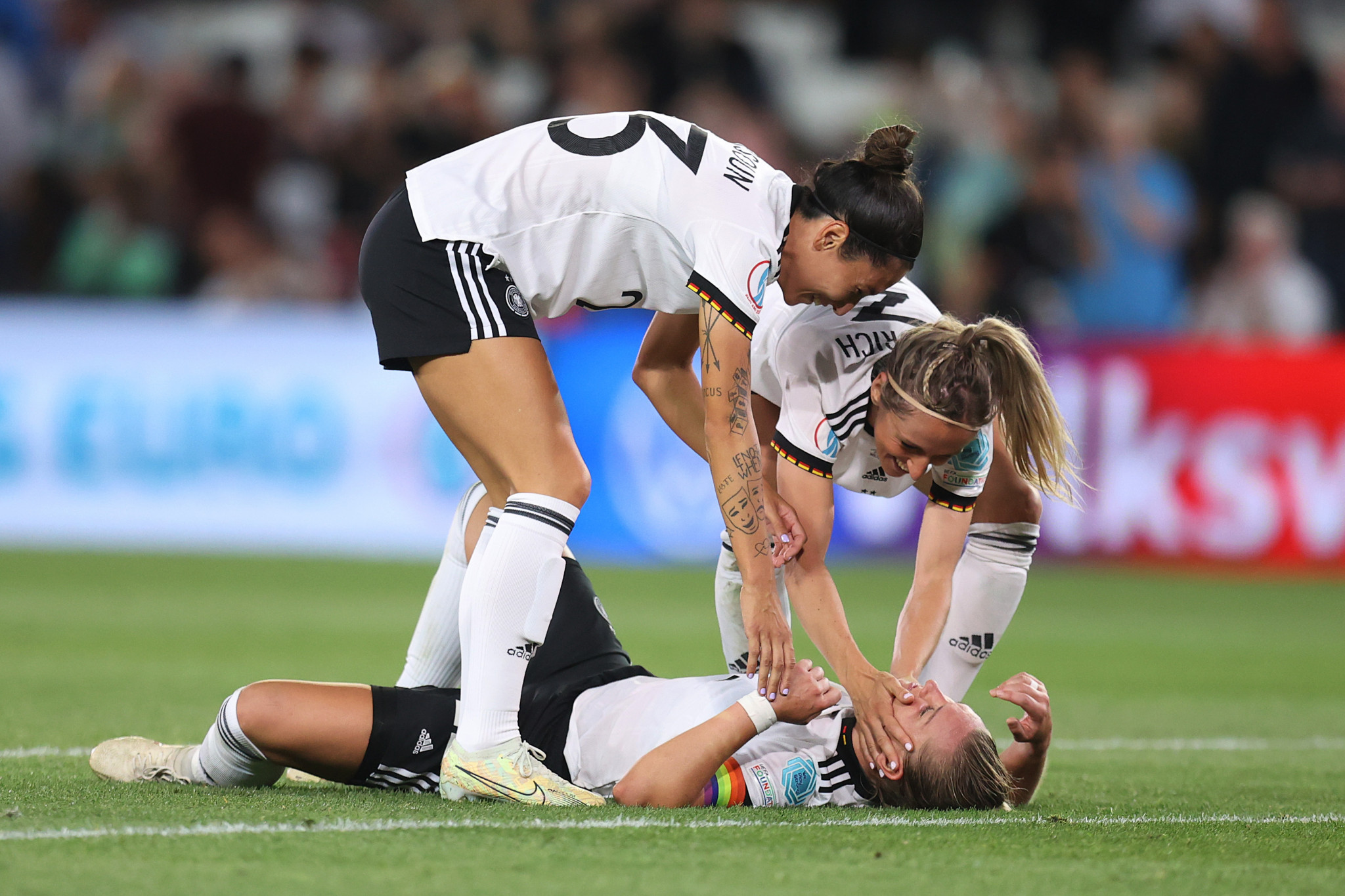 Alexandra Popp, pictured lying down, receives the congratulations of her teammates after putting Germany in front ©Getty Images