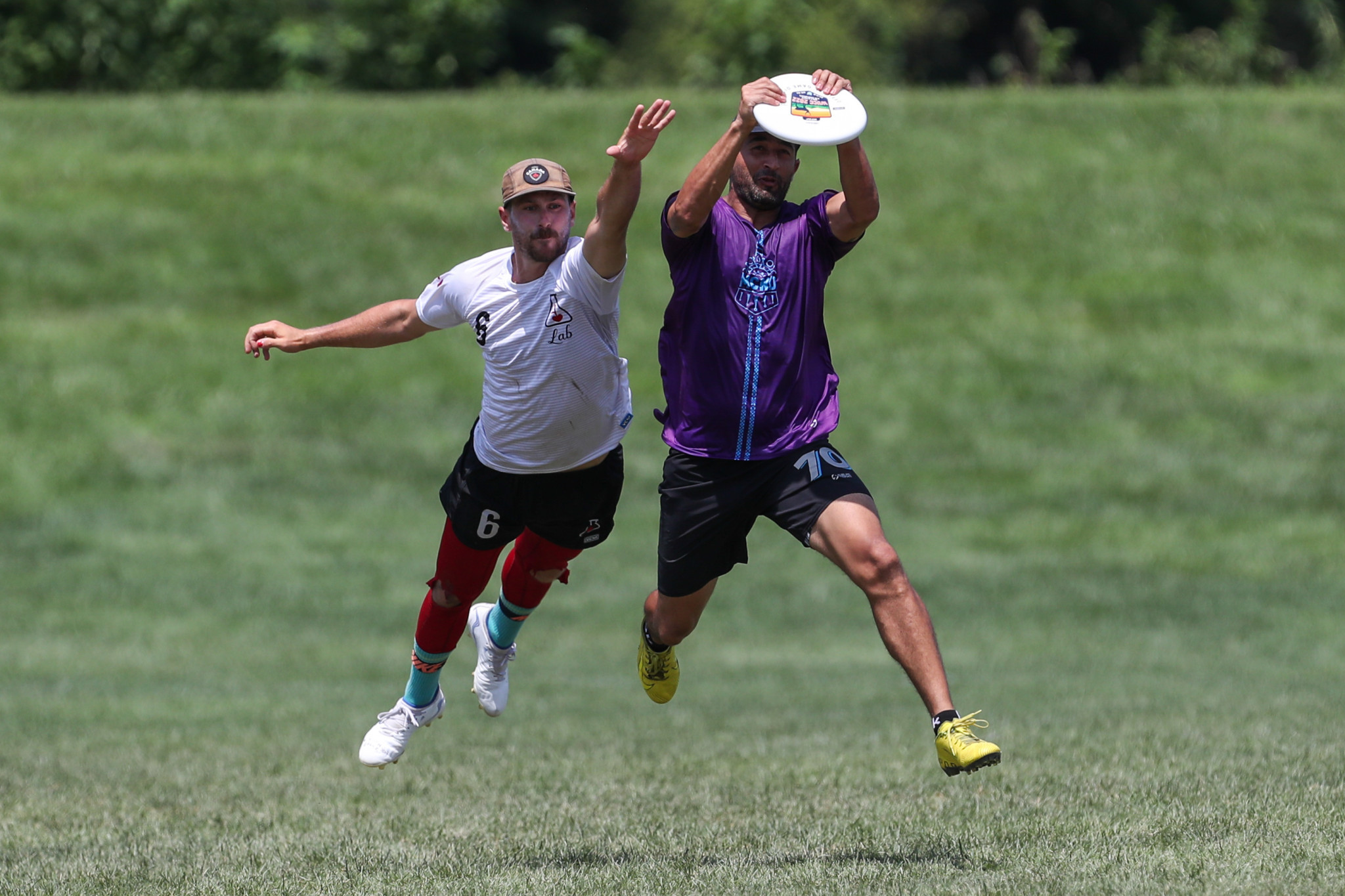  LAB's Felix Marceau, left, and Maconda's Daniel Montoya, right, battled for the disc during their match ©Paul Rutherford for UltiPhotos