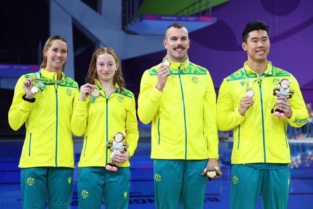 Kyle Chalmers, second right, pictured after winning 4x100m freestyle relay gold at Birmingham 2022 alongside Emma McKeon, left ©Getty Images