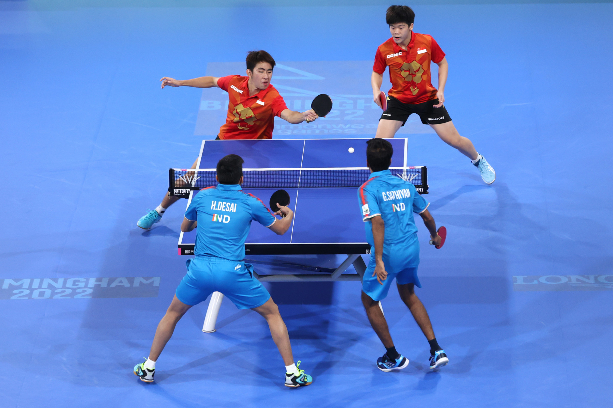 Harmeet Desai, front left, and Sathiyan Gnanasekaran, front right, won doubles and singles matches for India in the men's team table tennis final ©Getty Images