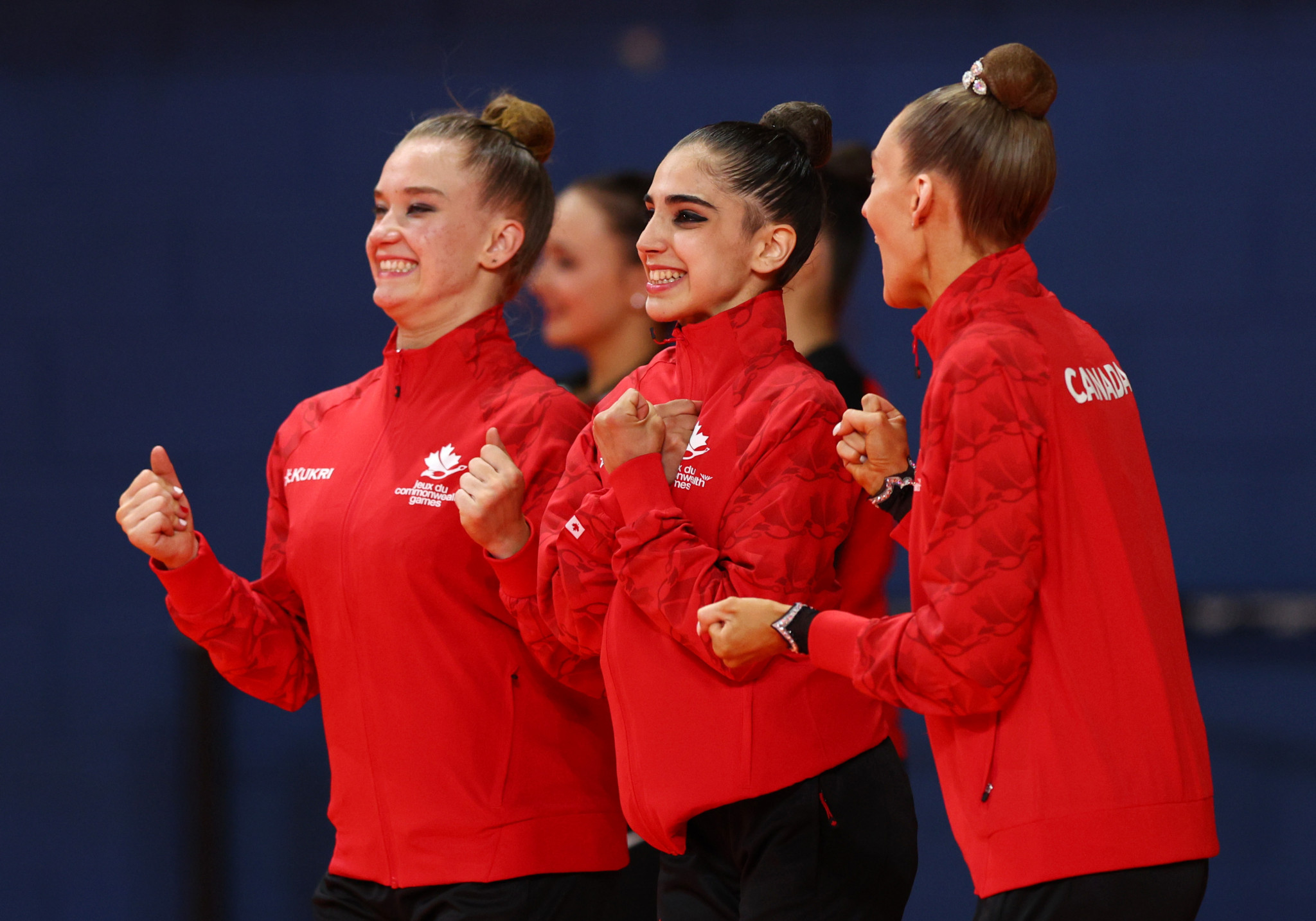 Canada celebrate winning the rhythmic gymnastics team title ©Getty Images