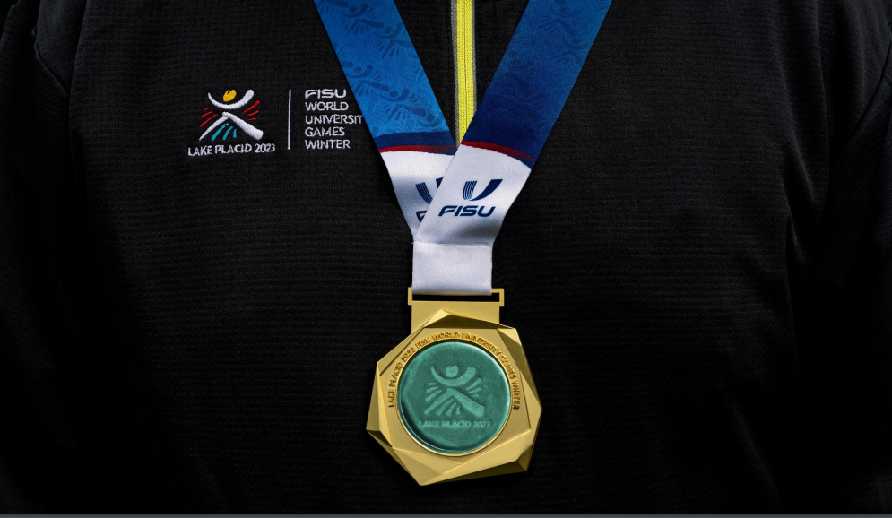 The stylised image of a collegiate athlete is the central motif of the medal  ©Lake Placid 2023