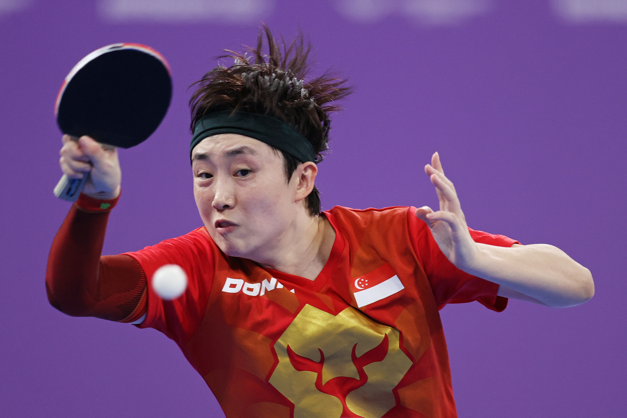 Feng Tianwei of Singapore beat compatriot Zeng Jian 4-3 in the women's table tennis singles decider before teaming up to qualify for the doubles final ©Getty Images