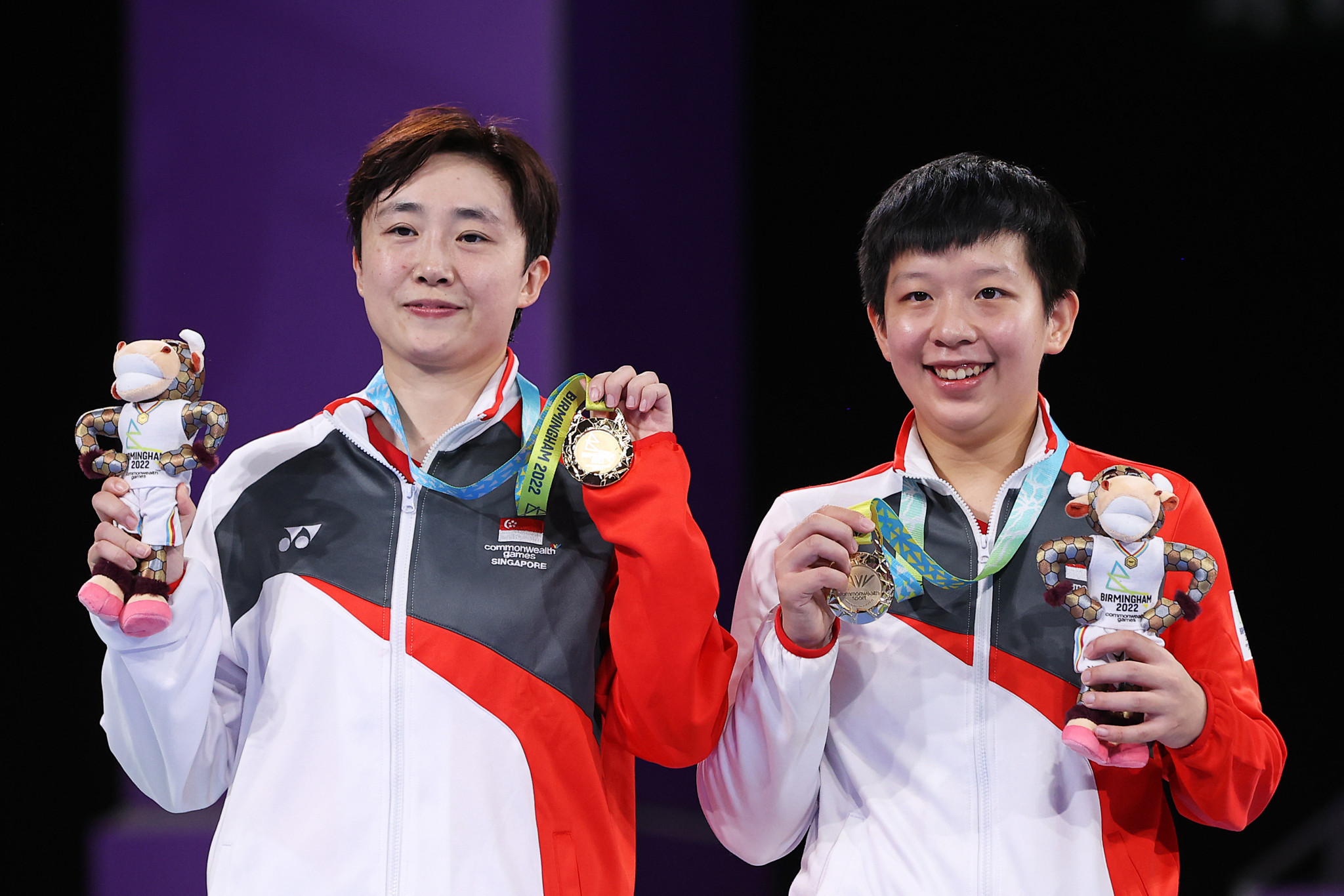 Feng Tianwei, left, became the most decorated table tennis player in Commonwealth Games history after winning women's doubles gold for Singapore with Zeng Jian, right ©Getty Images