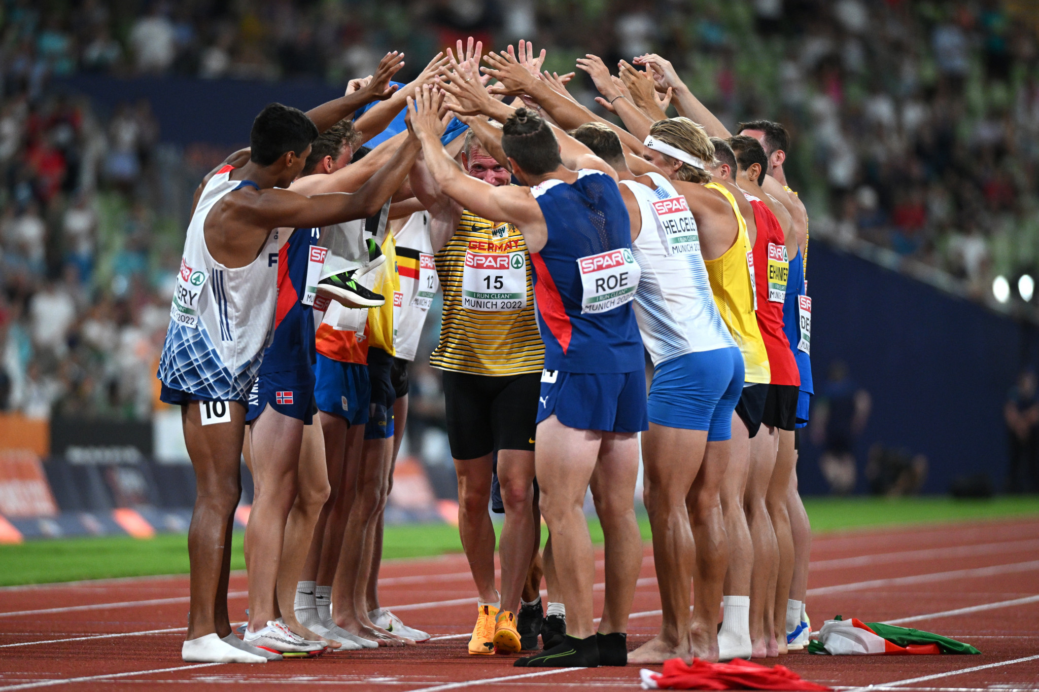 Germany's Arthur Abele receives a guard of honour from fellow competitors following the men's decathlon ©Getty Images