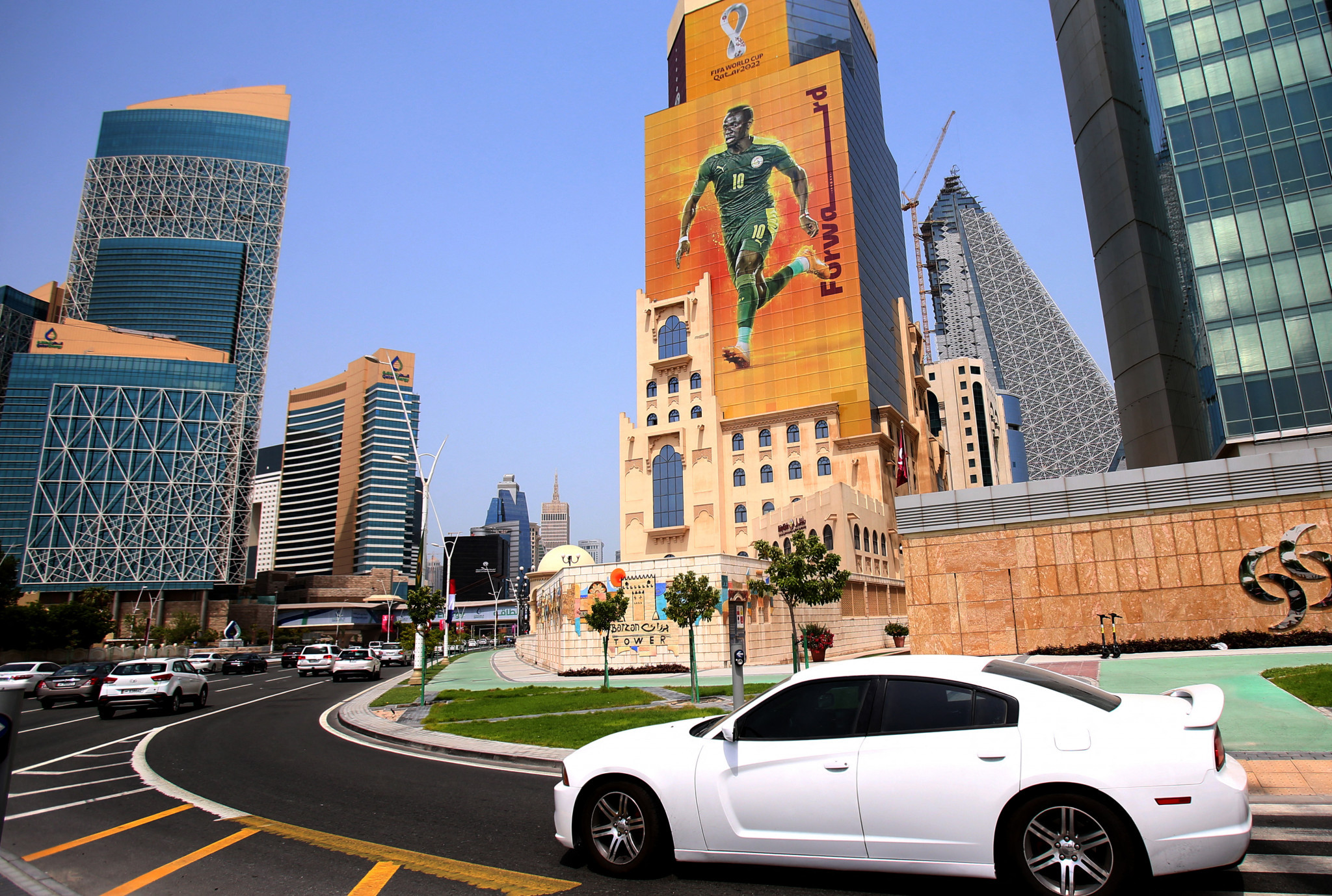 Qatari capital Doha is getting ready for the World Cup with huge posters of footballers seen on buildings around the city ©Getty Images
