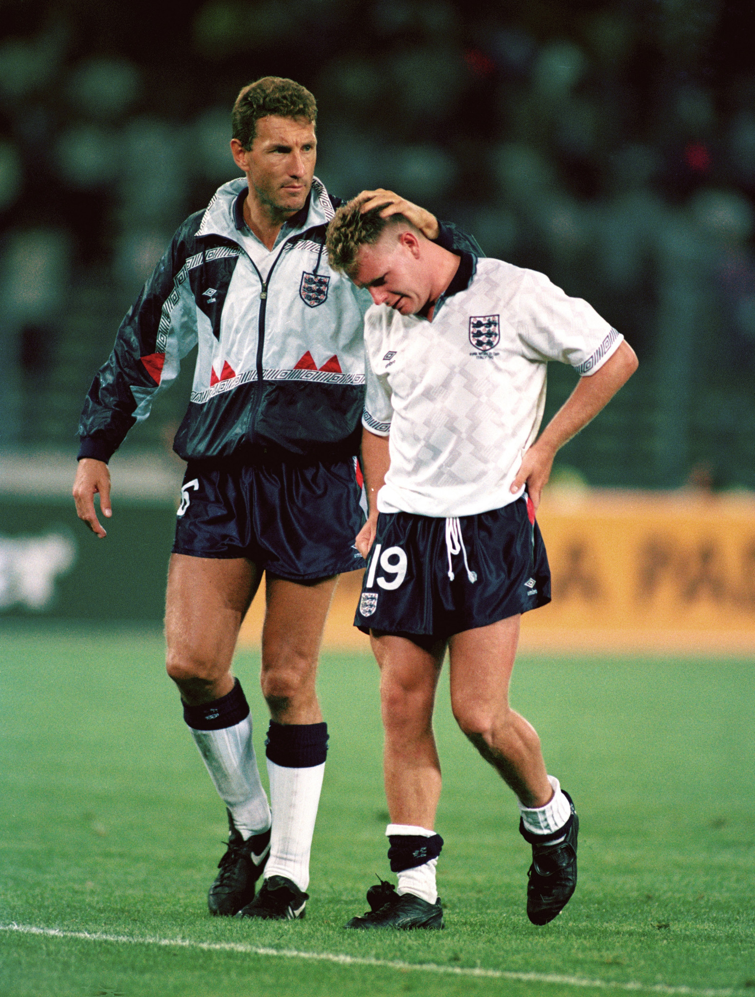 England teammate Terry Butcher consoles Paul Gascoigne, right, after the 1990 World Cup semi-final against West Germany ©Getty Images