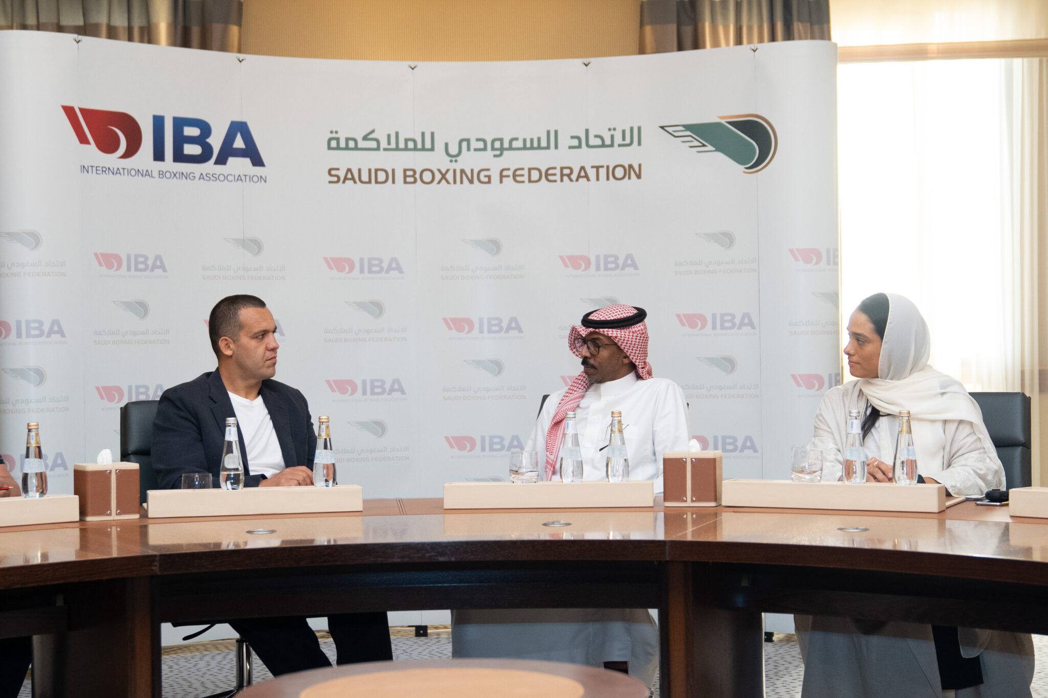 IBA President Umar Kremlev, left, with Saudi Arabian Boxing Federation President Abdullah Hamad Al Harbi and vice-president Rasha Mohamed Al-Khamis ©IBA