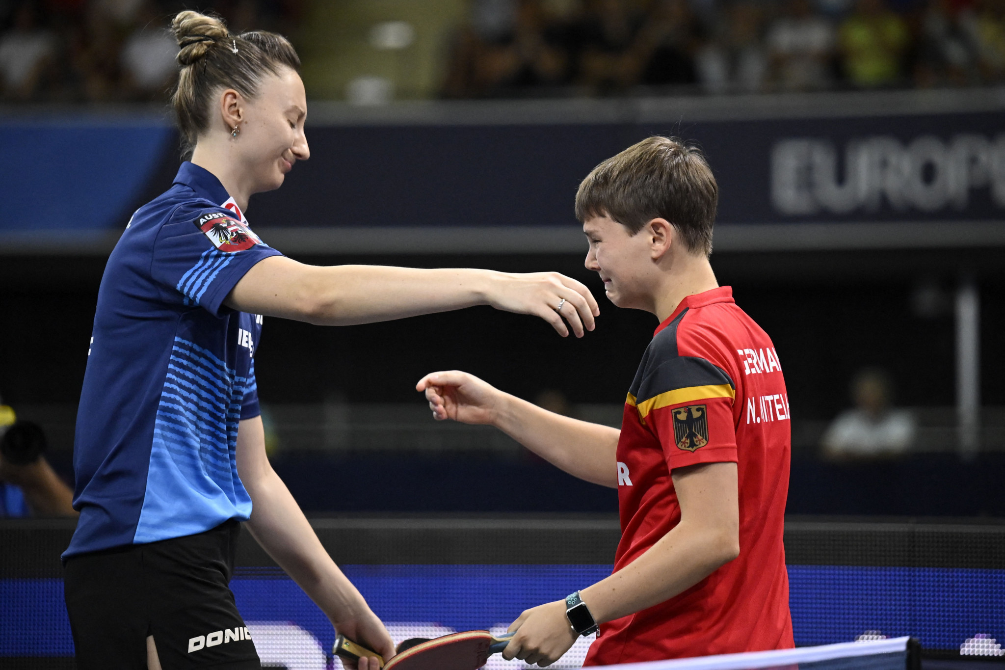 Germany's Nina Mittelham, right, picked up a shoulder injury in the women's singles table tennis final against Austria's Sofia Polcanova, left ©Getty Images