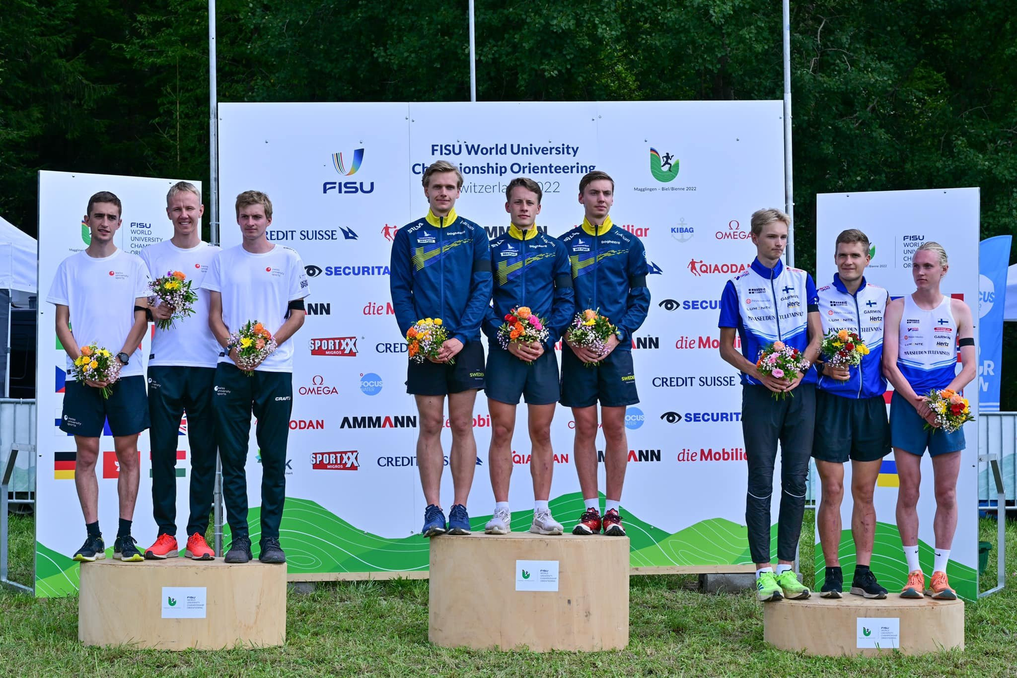 The Swedish men's relay team, centre, triumphed over Switzerland, left, and Finland, right ©FISU/Twitter