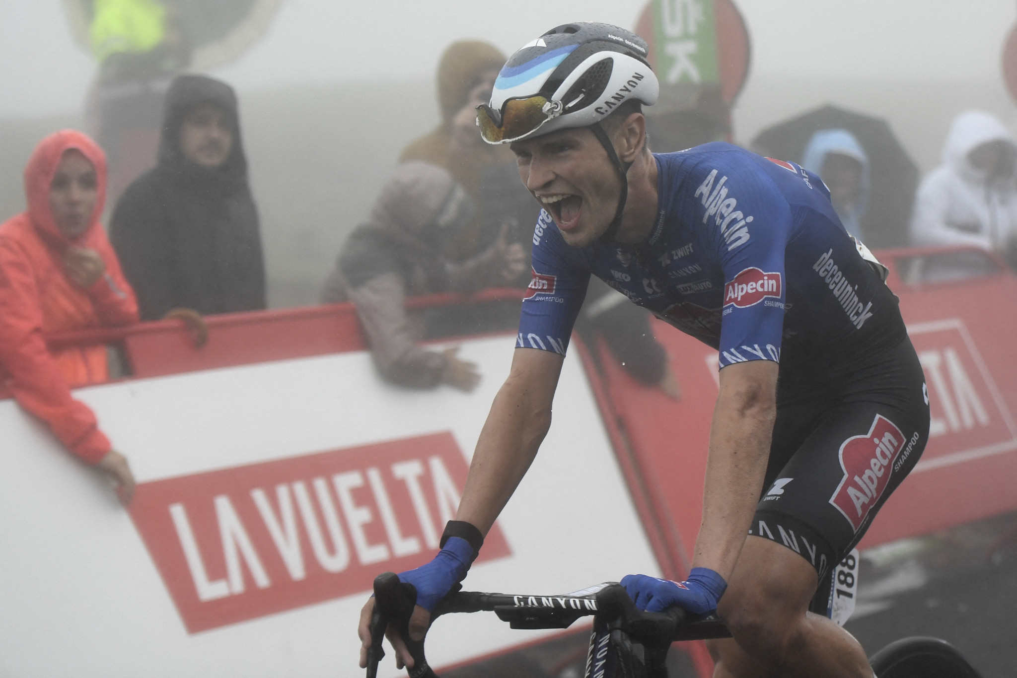 Vine wins rain-hit sixth stage as Evenepoel takes Vuelta a España lead