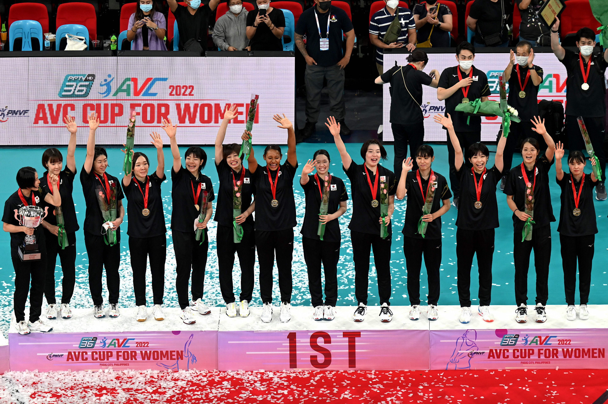 Japan's players celebrate on the podium after winning the Asian Women's Volleyball Cup ©Getty Images