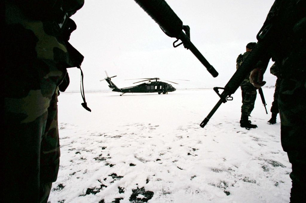 National Guards Military Policemen at an undisclosed location guard Black Hawk helicopters used during the 2002 Salt Lake City Winter Olympic Games ©Getty Images