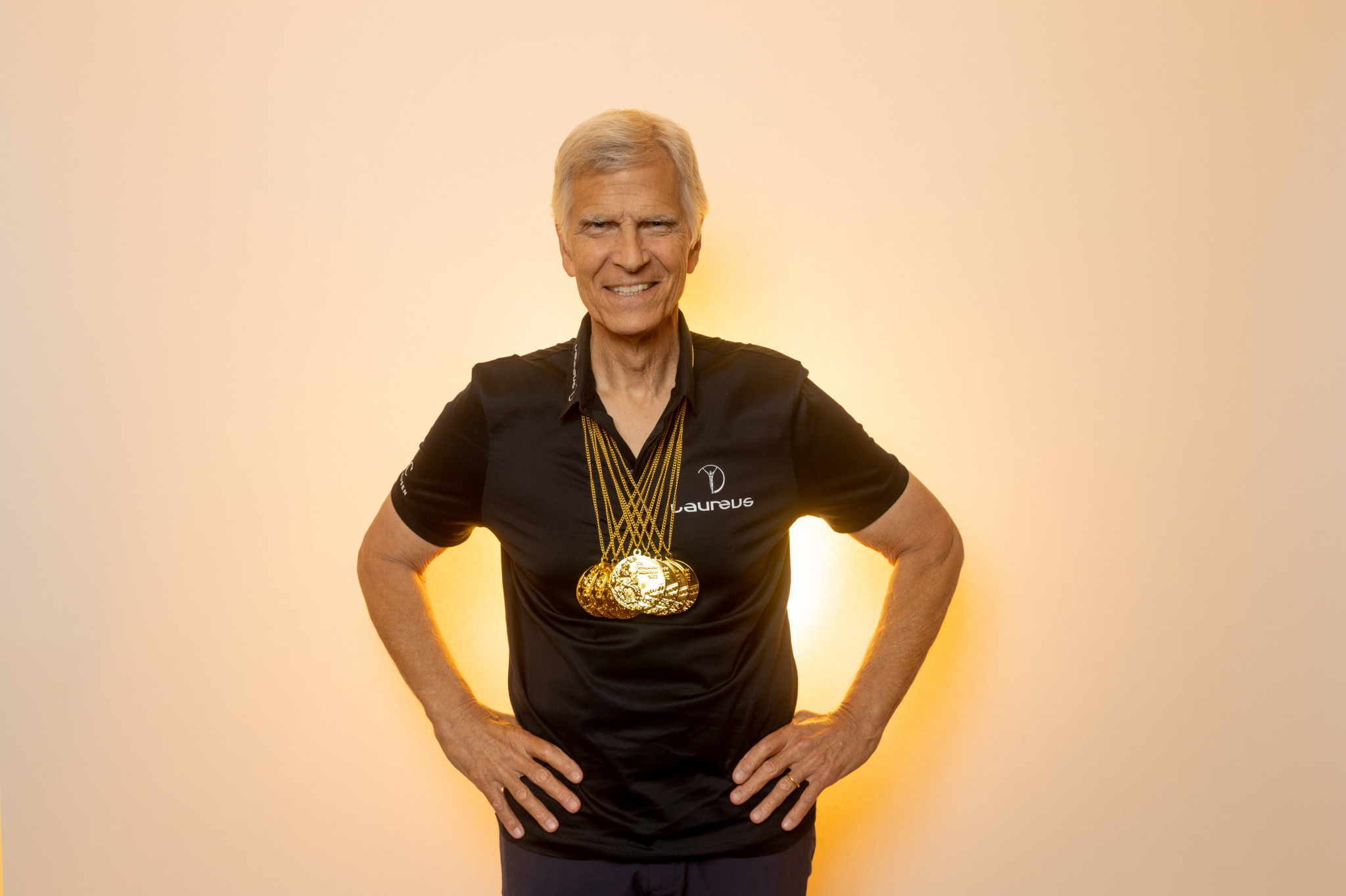 Mark Spitz recreates a famous pose with his seven gold medals from 1972 ©Laureus Sport for Good