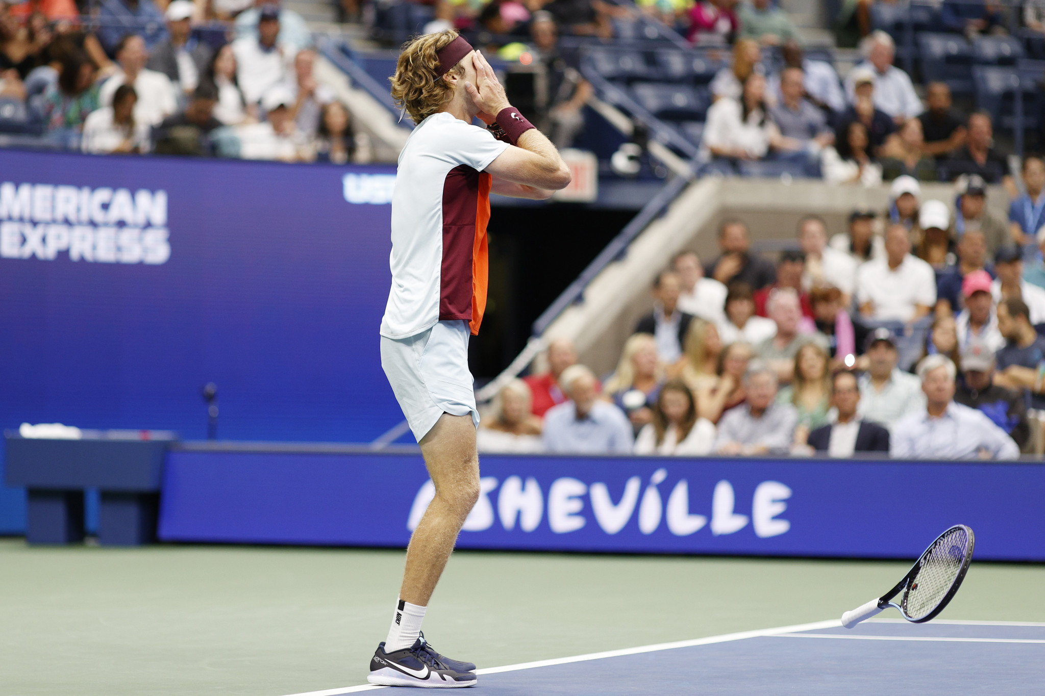 Andrey Rublev drops his racket in frustration during his match with Tiafoe ©Getty Images