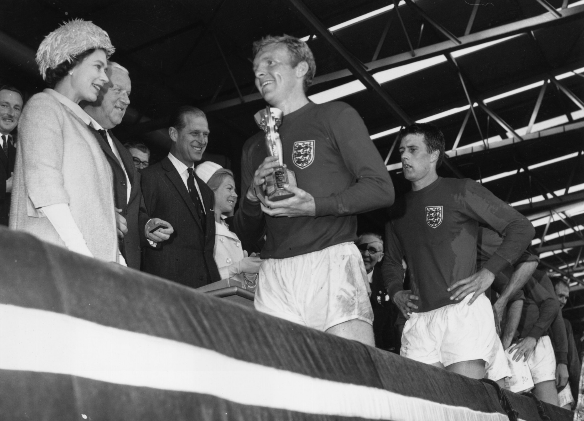 Queen Elizabeth II, left, during the presentation of the 1966 Football World Cup trophy, to England captain Sir Bobby Moore ©Getty Images