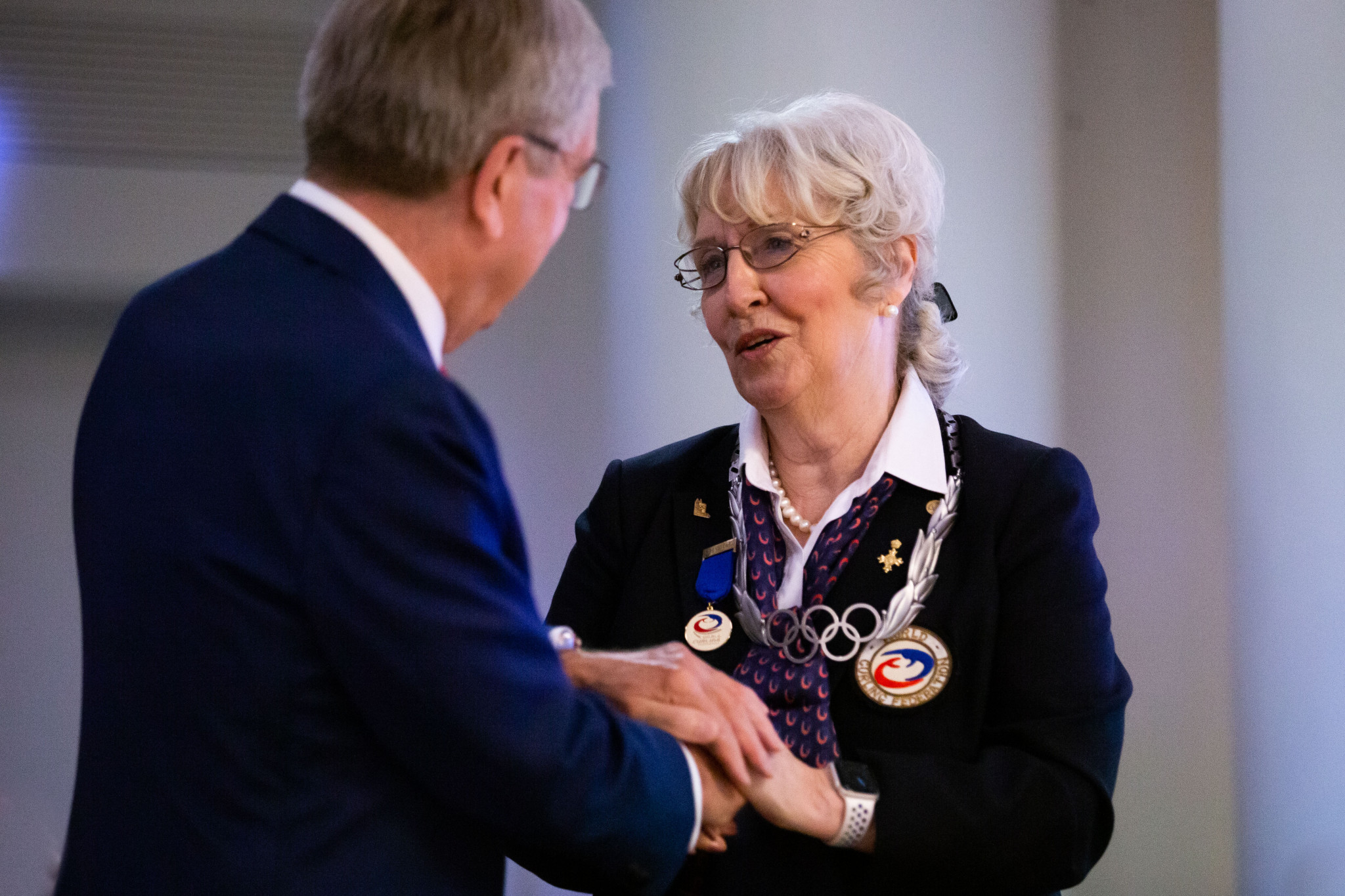Former WCF President Kate Caithness has been awarded with the Olympic Order from IOC President Thomas Bach ©WCF/Celine Stucki