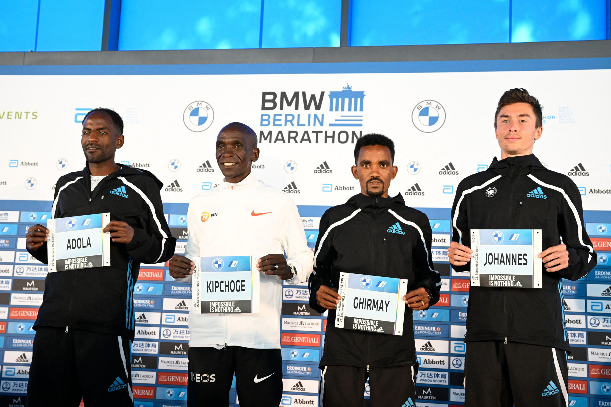 Eliud Kpchoge, second left, is not being drawn on whether he can set another marathon world record on the Berlin course tomorrow ©Getty Images
