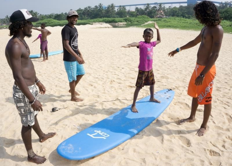 instructors teaching children on an ISA educational course ©Surfing Federation of India