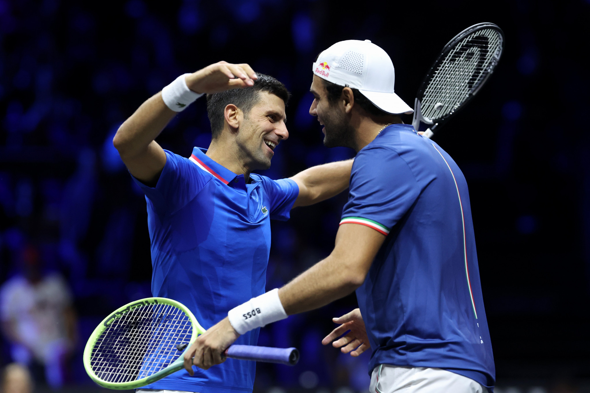 Novak Djokovic, left, embraces Matteo Berrettini  after the pair win the doubles match to give Europe an overnight lead at the Laver Cup ©Getty Images