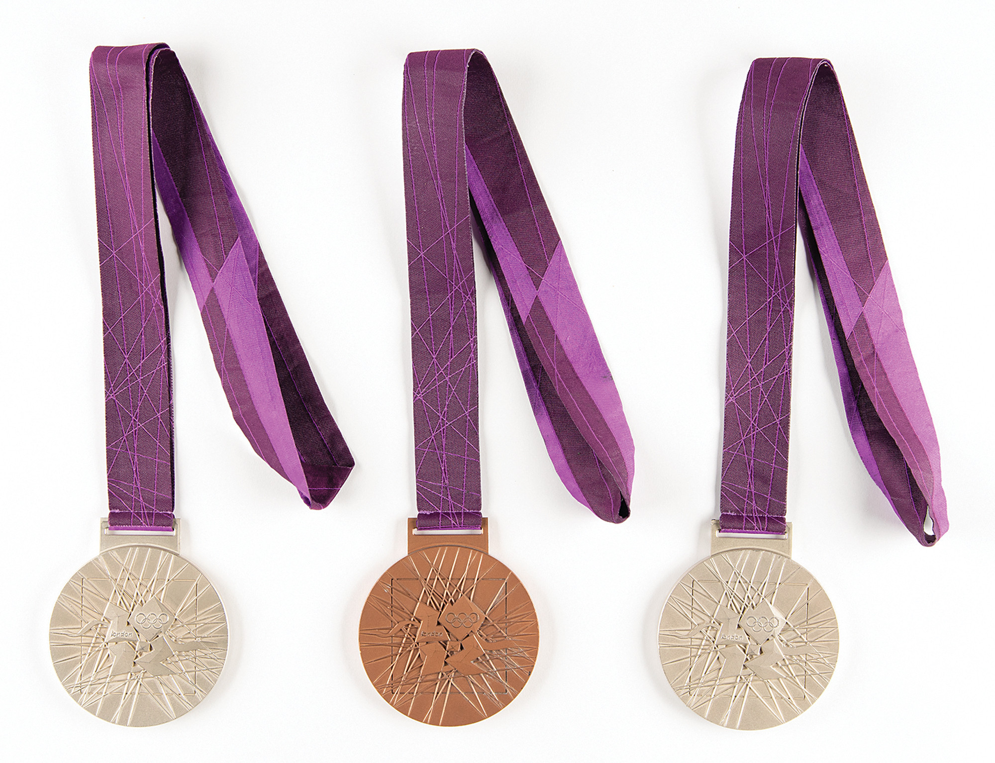 Ryan Lochte has auctioned off half of his 12 Olympic medals, including the two silver and bronze from London 2012 ©RR Auctions