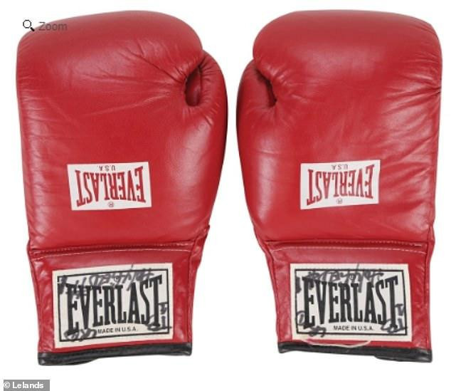 Evander Holyfield's gloves from his famous fight against Mike Tyson in Las Vegas in 1997 have been sold at auction ©Lelands