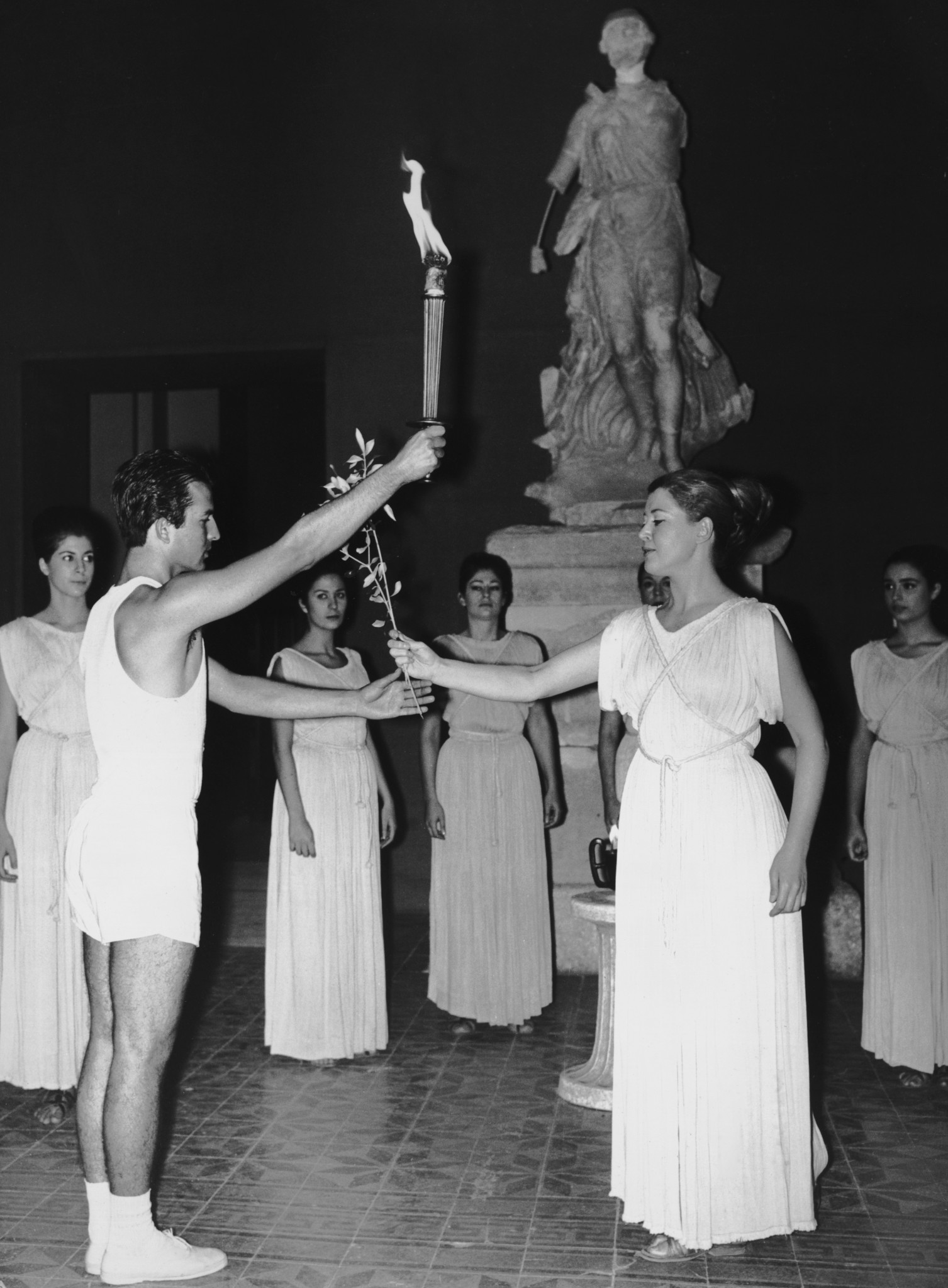 Bad weather forced organisers to conduct the start of Grenoble 1968 Torch Relay inside the archaeological museum in Ancient Olympia ©Getty Images