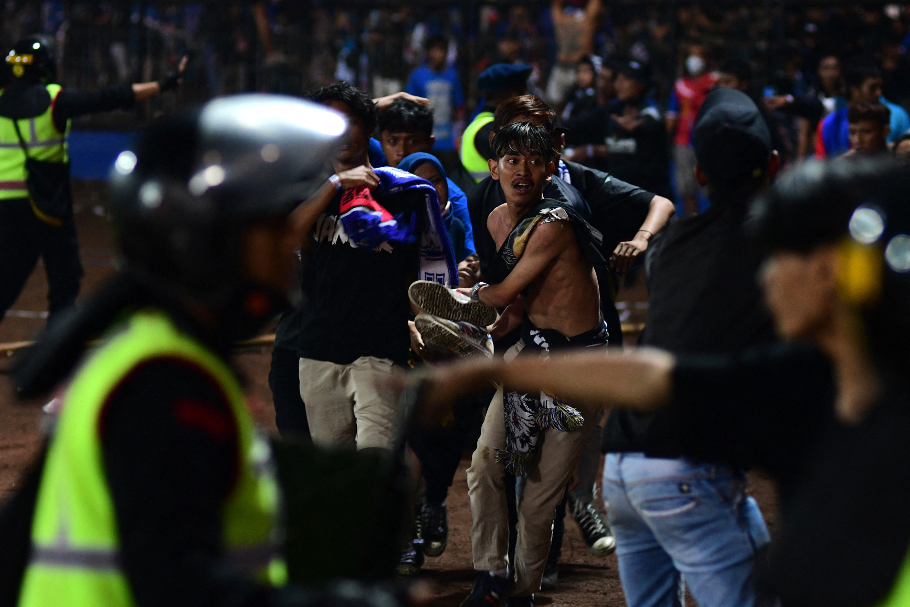 Panic erupted after police used tear gas to disperse pitch-invading spectators ©Getty Images