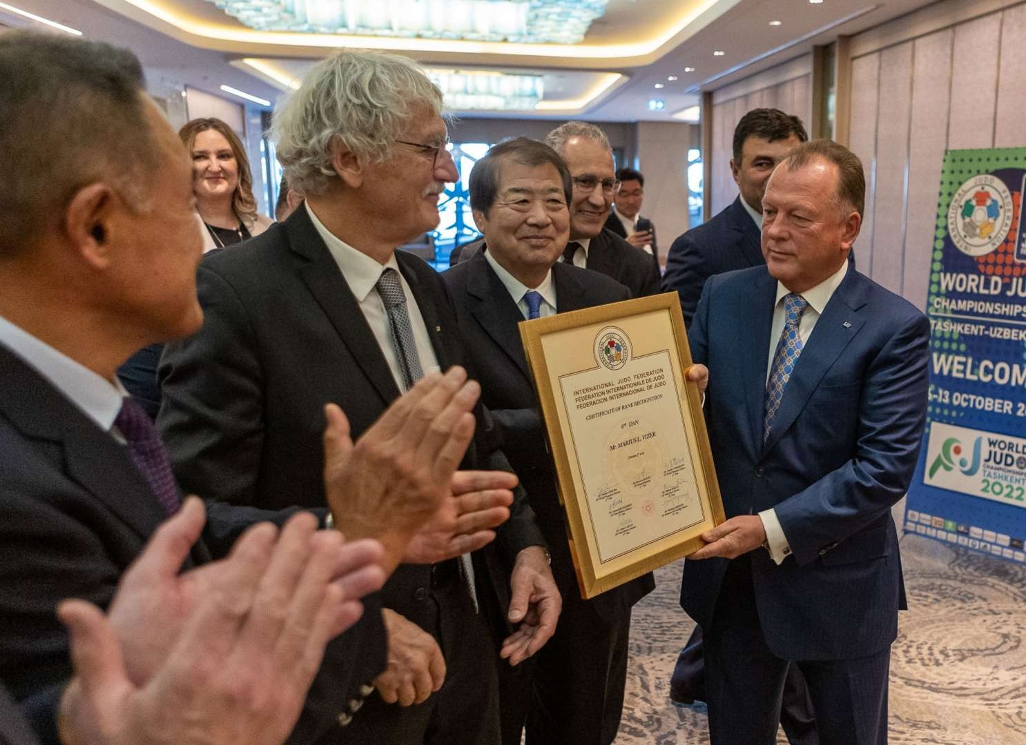 IJF President Marius Vizer, right, was emotional as he received the eighth dan, the sport's third-highest honour, as it was 