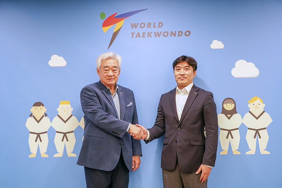 Chungwon Choue, left, welcomed Jeongkang Seo, right, to the permanent role ©World Taekwondo