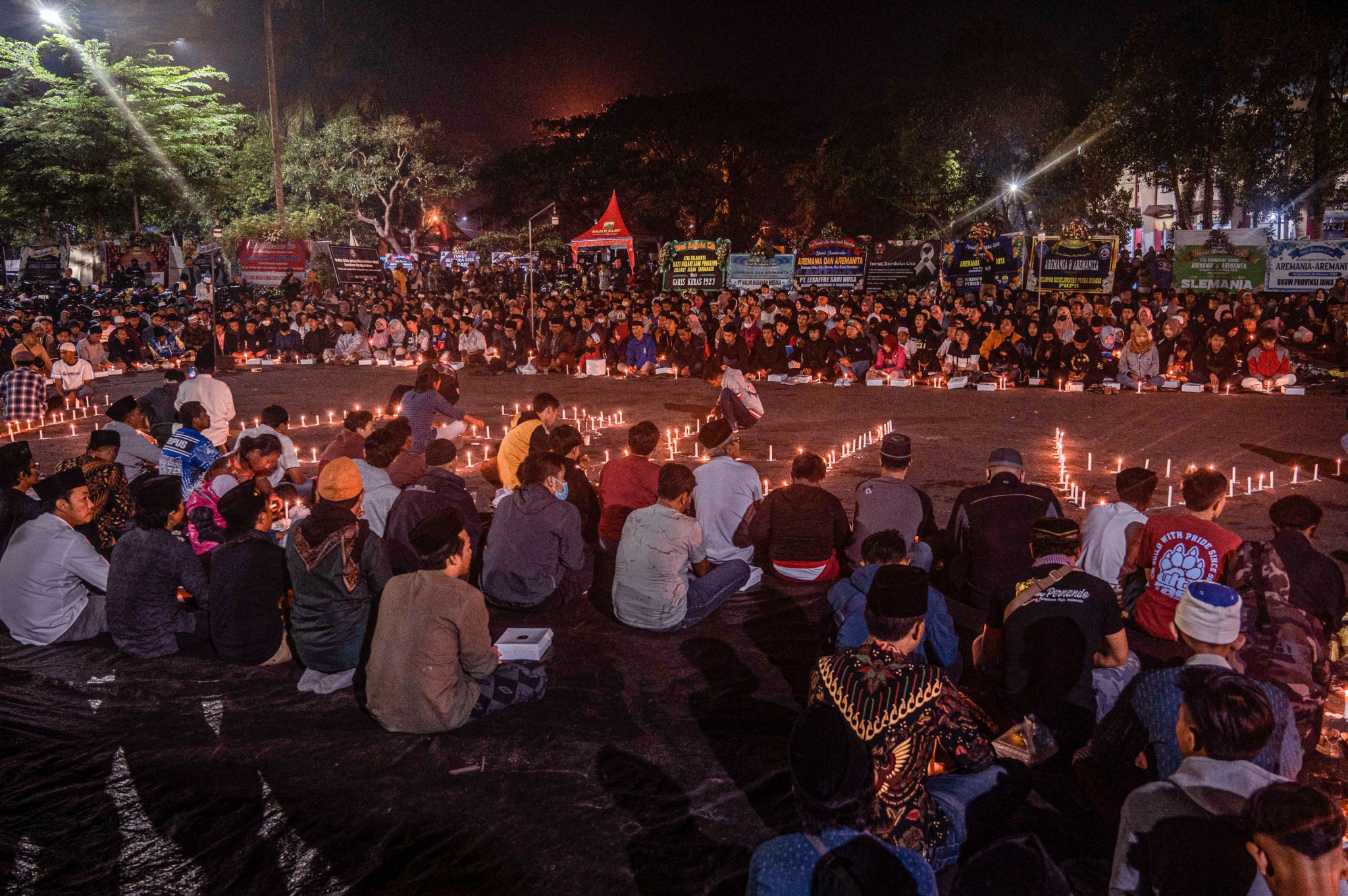 A candlelit vigil was held for victims of a stampede at the Kanjuruhan Stadium ©Getty Images